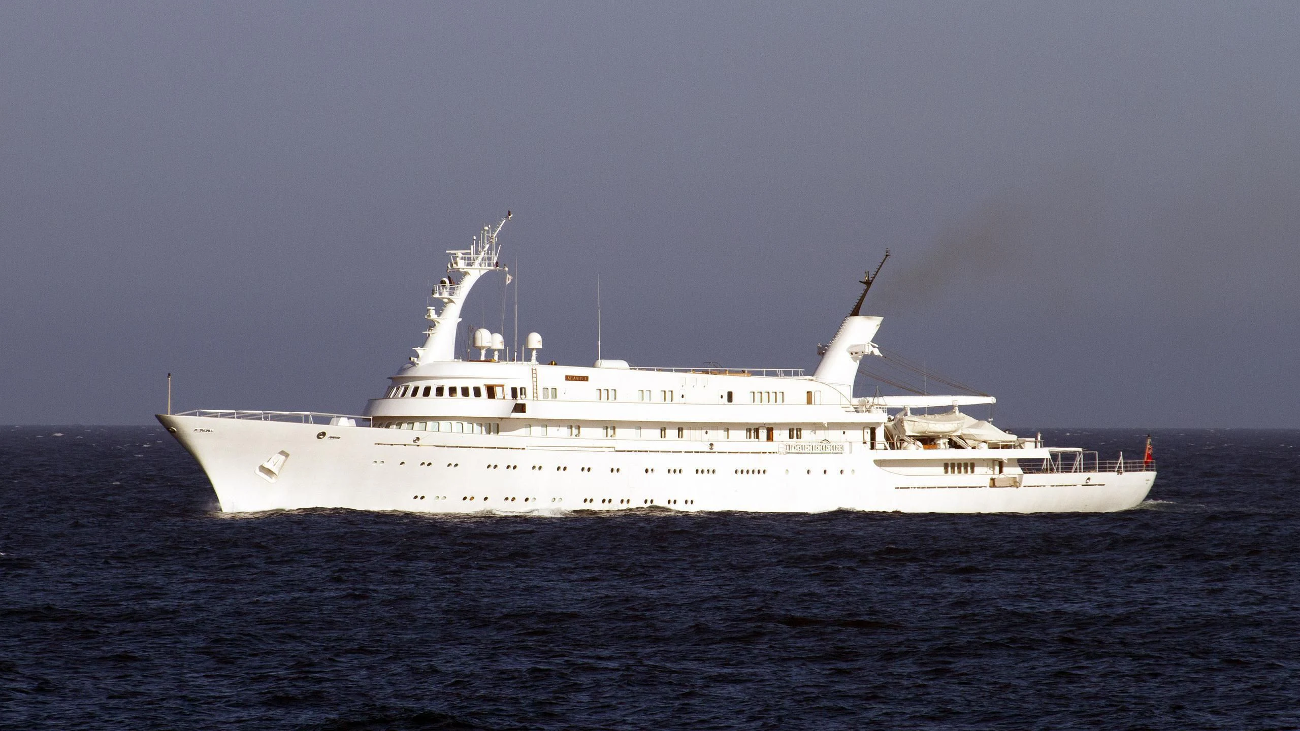 a large white ship in the water aboard ATLANTIS II Yacht for Sale