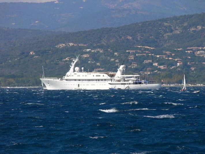 a large white boat in the water aboard ATLANTIS II Yacht for Sale