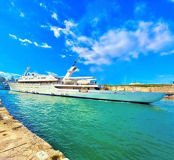 a large ship docked aboard ATLANTIS II Yacht for Sale