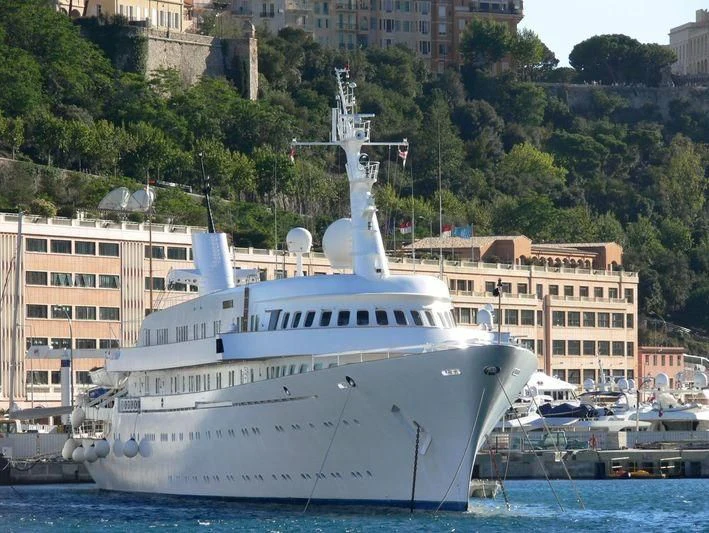 a large white boat in the water aboard ATLANTIS II Yacht for Sale