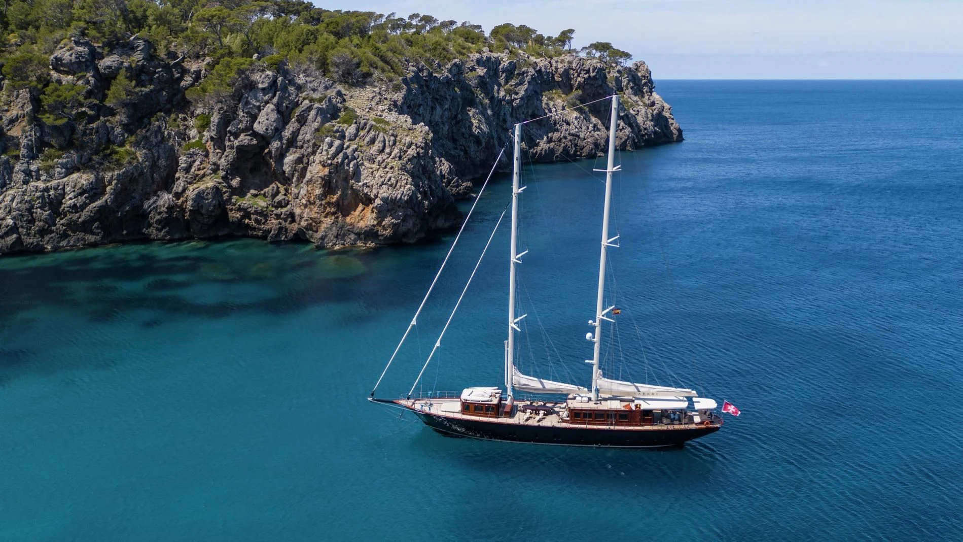 a boat sailing on the sea aboard SATORI Yacht for Charter