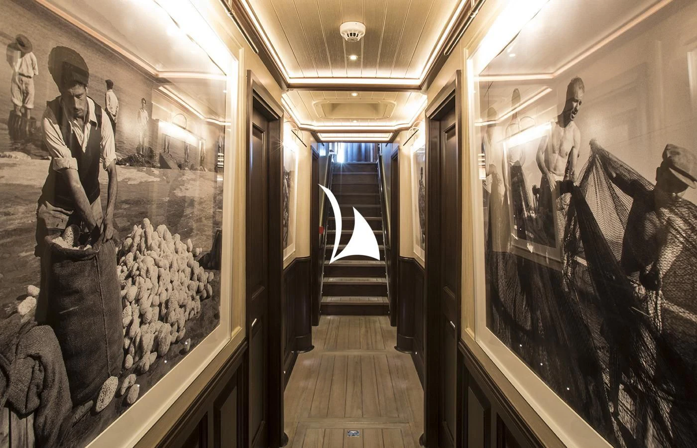 a hallway with art aboard SATORI Yacht for Charter