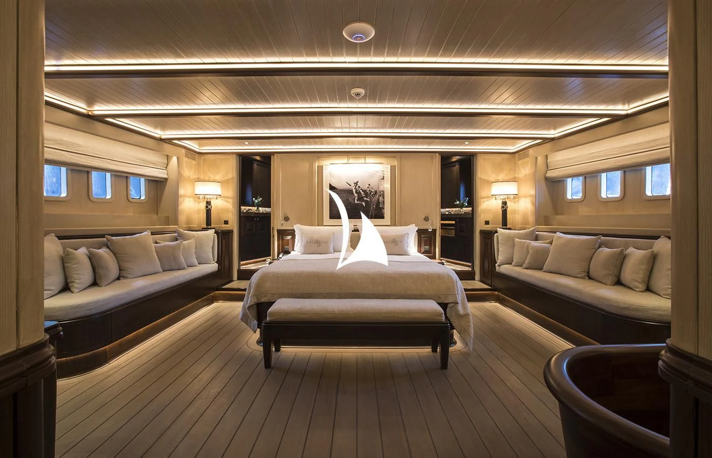 a room with a bed and a couch aboard SATORI Yacht for Charter