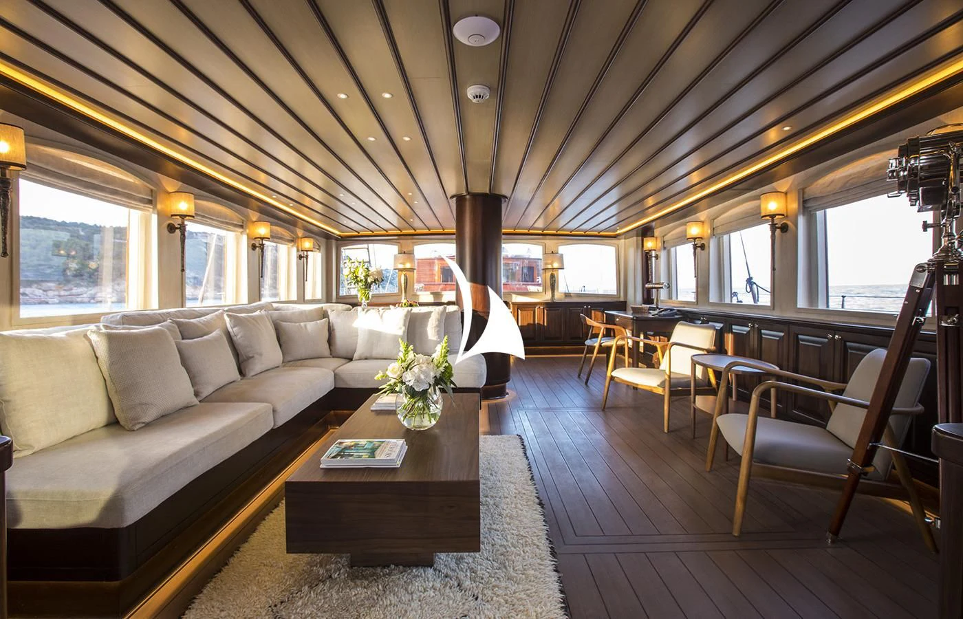a living room with a couch and a coffee table aboard SATORI Yacht for Charter