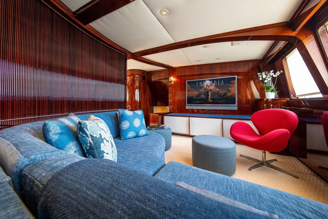a living room with a couch and a television aboard MIKADO Yacht for Sale