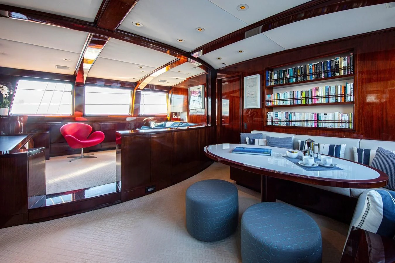 a room with a table and chairs aboard MIKADO Yacht for Sale