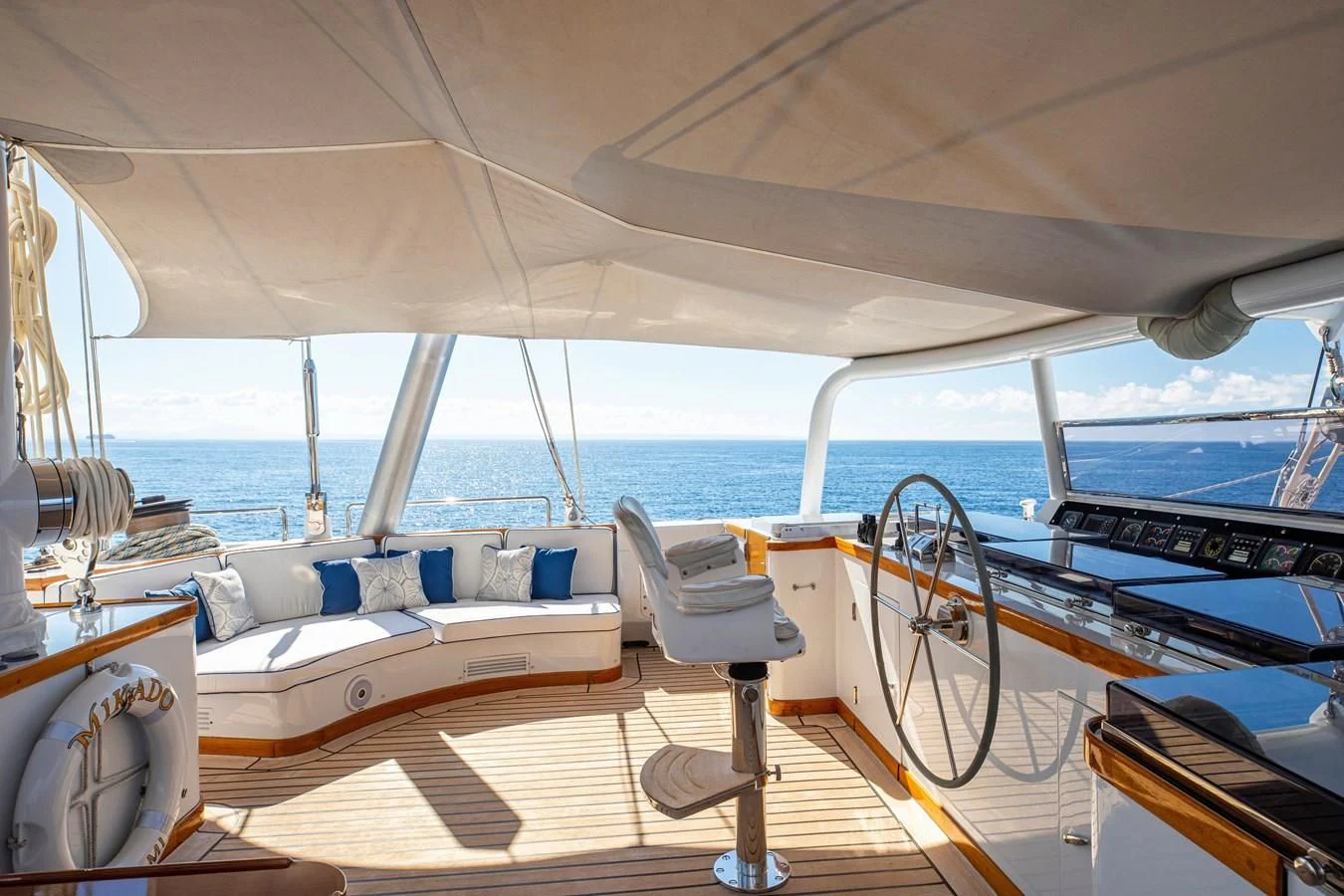 a boat with a deck and chairs aboard MIKADO Yacht for Sale