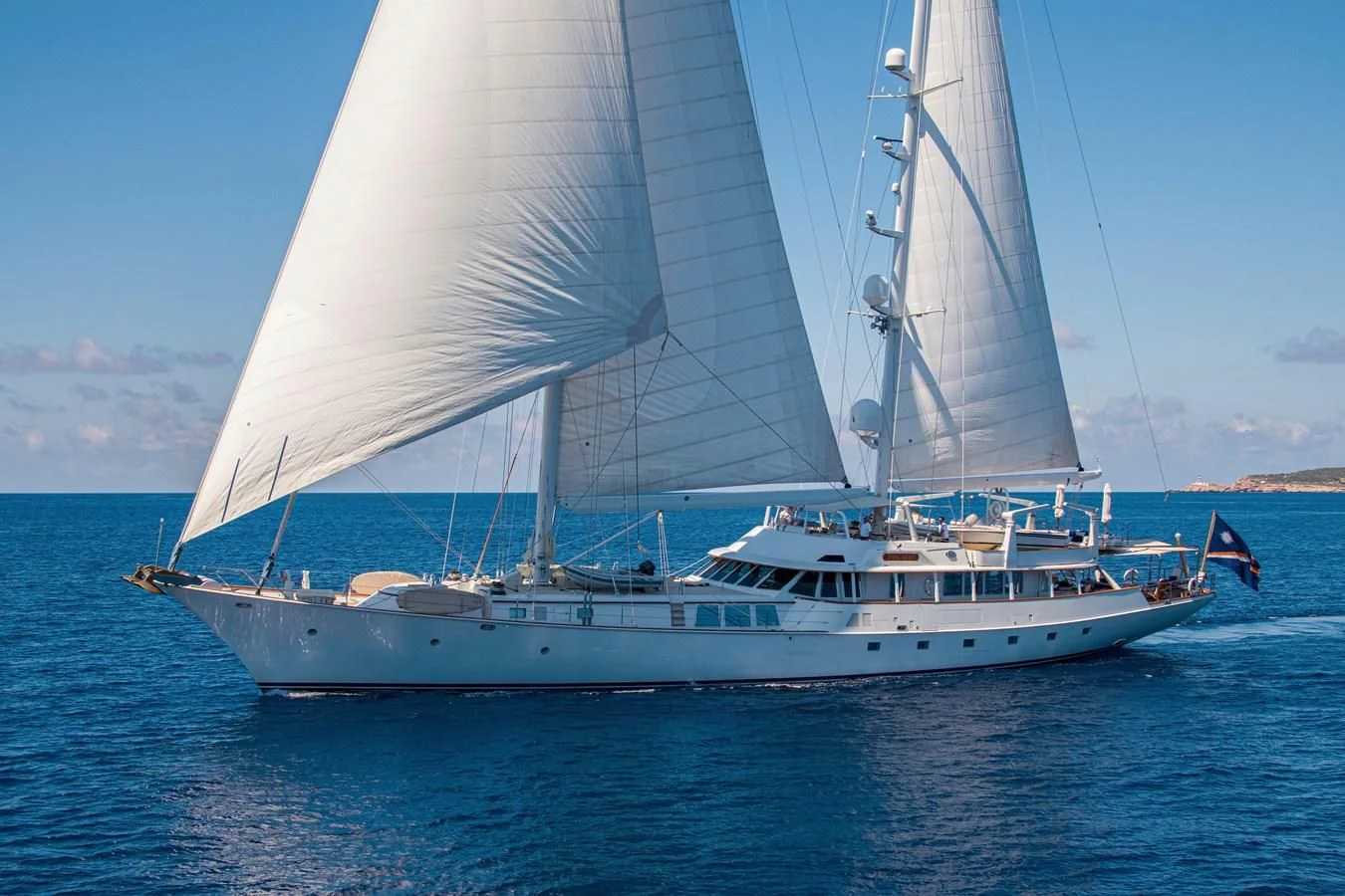 a white boat on the water aboard MIKADO Yacht for Sale