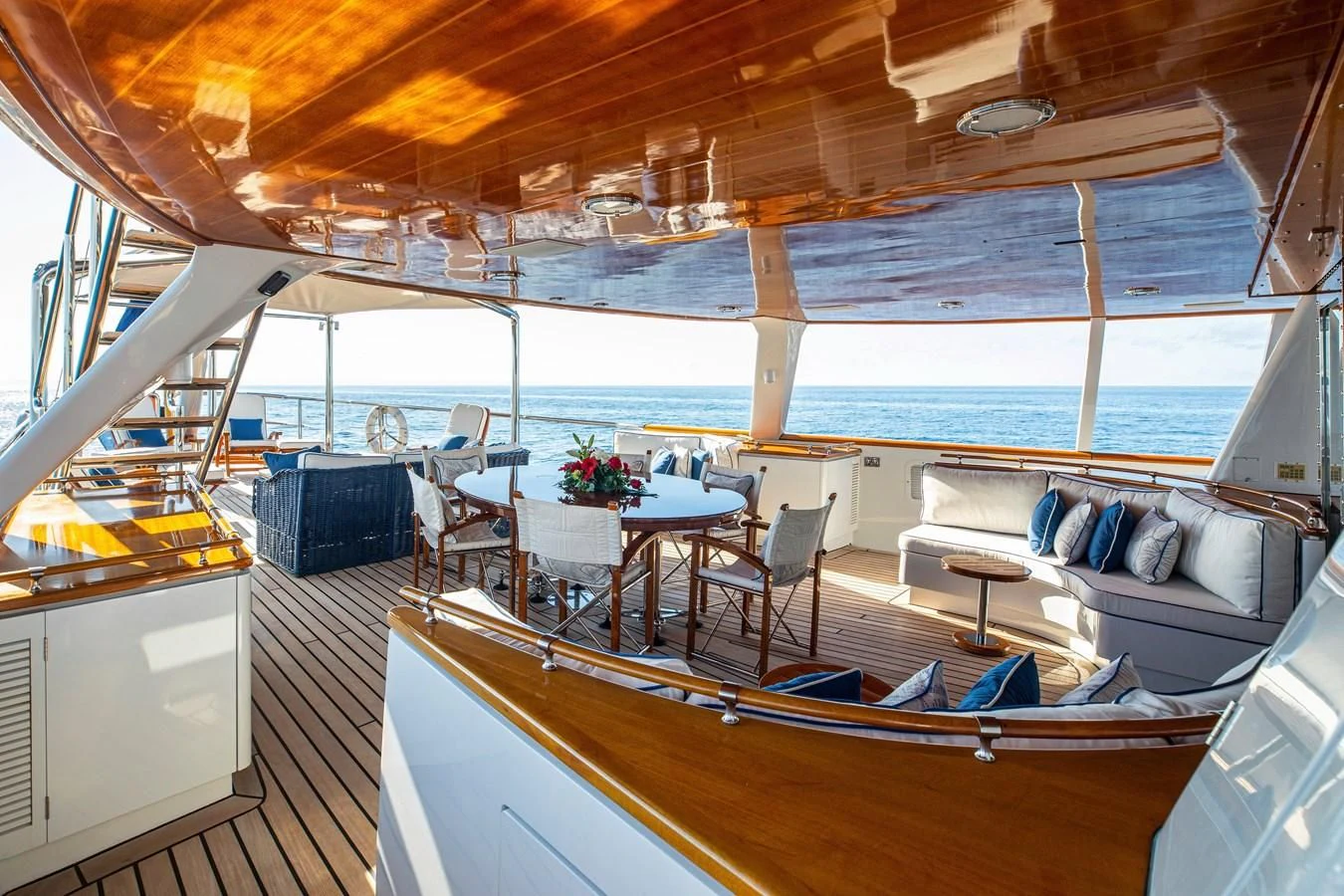 a boat with a table and chairs aboard MIKADO Yacht for Sale