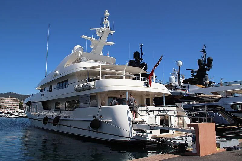 a large white boat with a crew on it aboard RAHAL Yacht for Sale