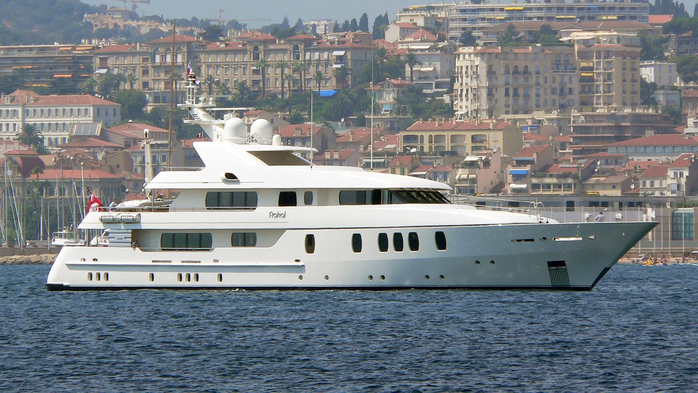 a large white boat in the water aboard RAHAL Yacht for Sale
