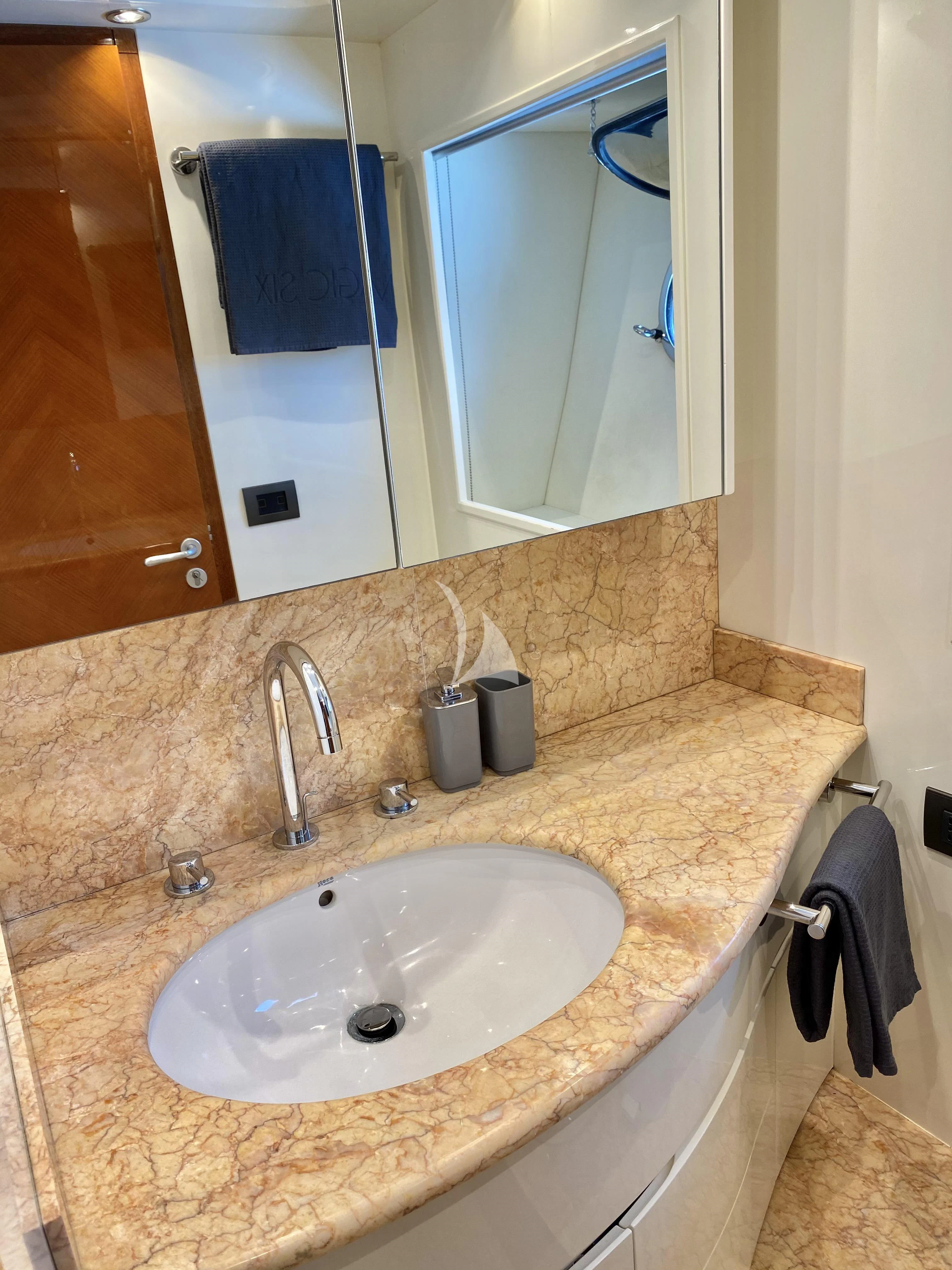 a bathroom with a sink and a mirror aboard MAGIC SIX Yacht for Sale