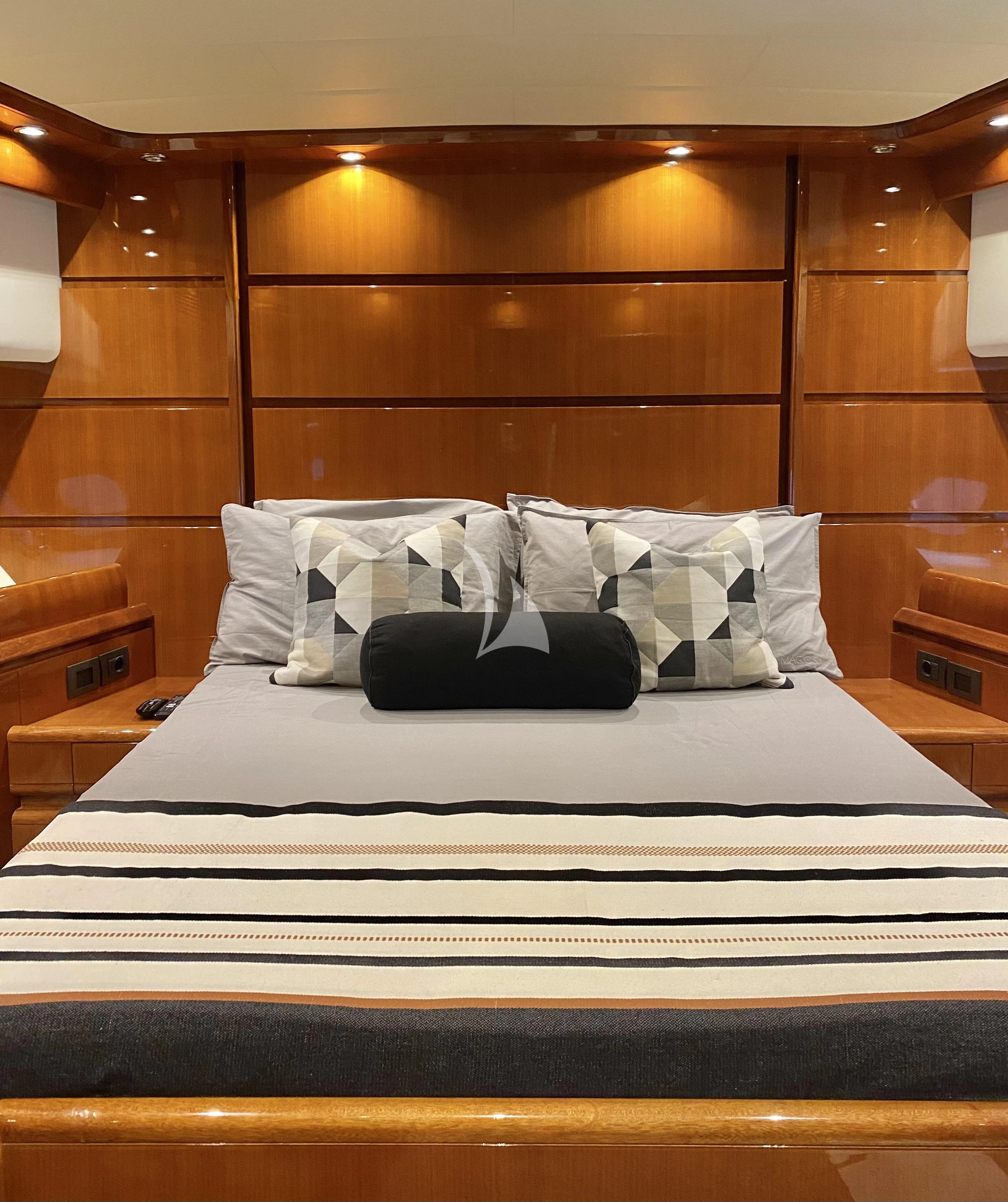 a bed with white sheets aboard MAGIC SIX Yacht for Sale