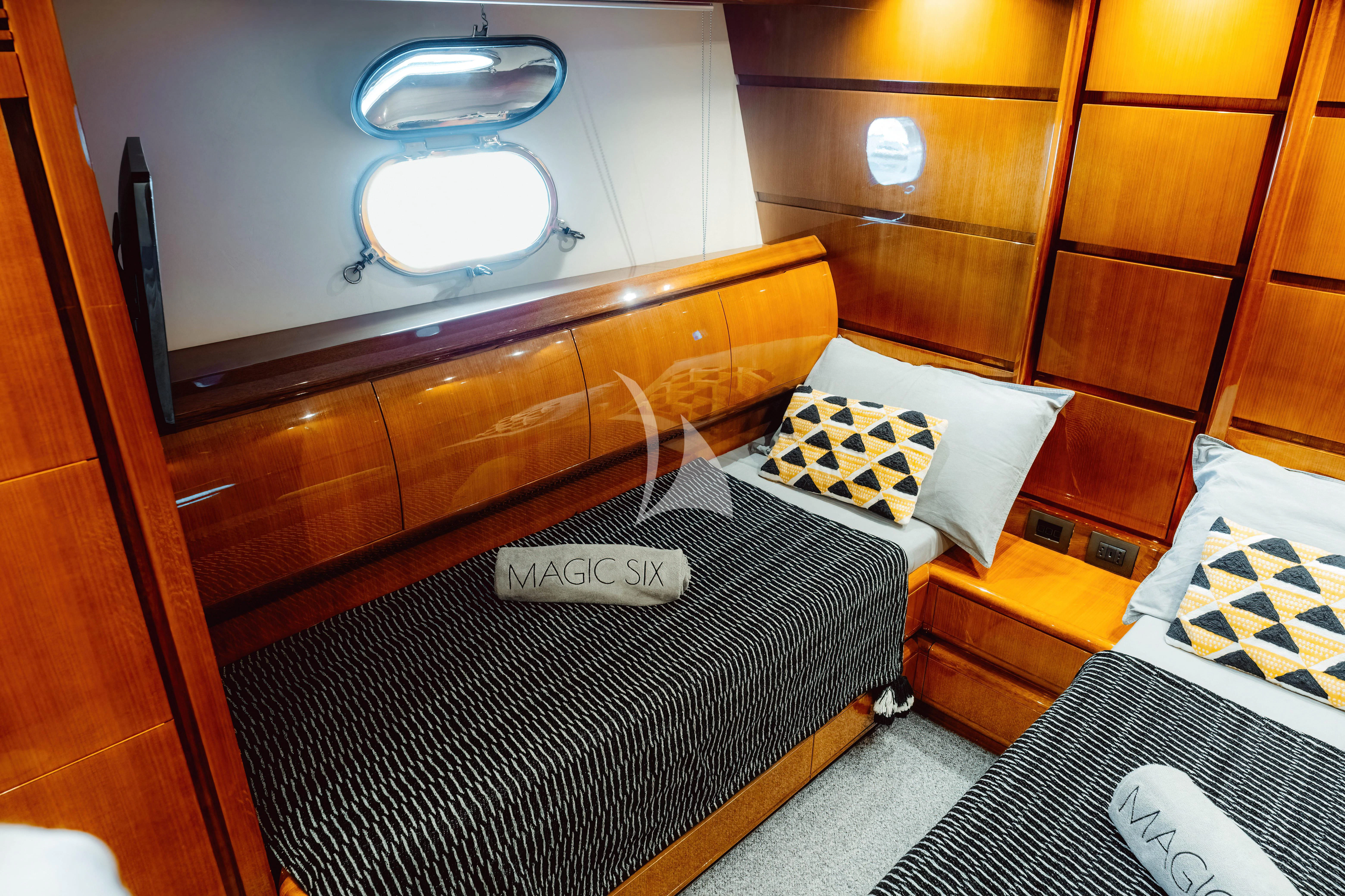 a room with a bed and a mirror aboard MAGIC SIX Yacht for Sale
