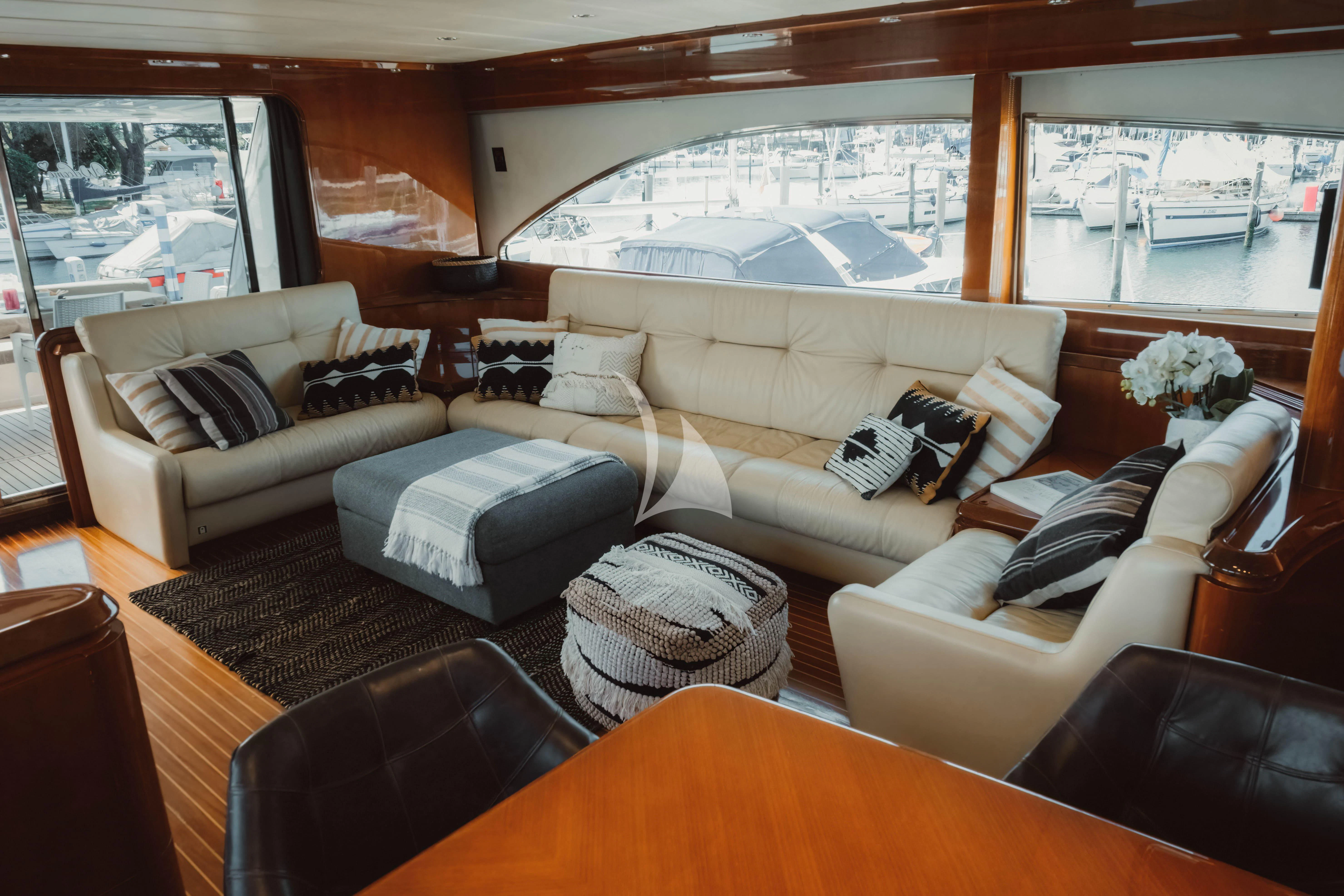 a living room with a large window aboard MAGIC SIX Yacht for Sale