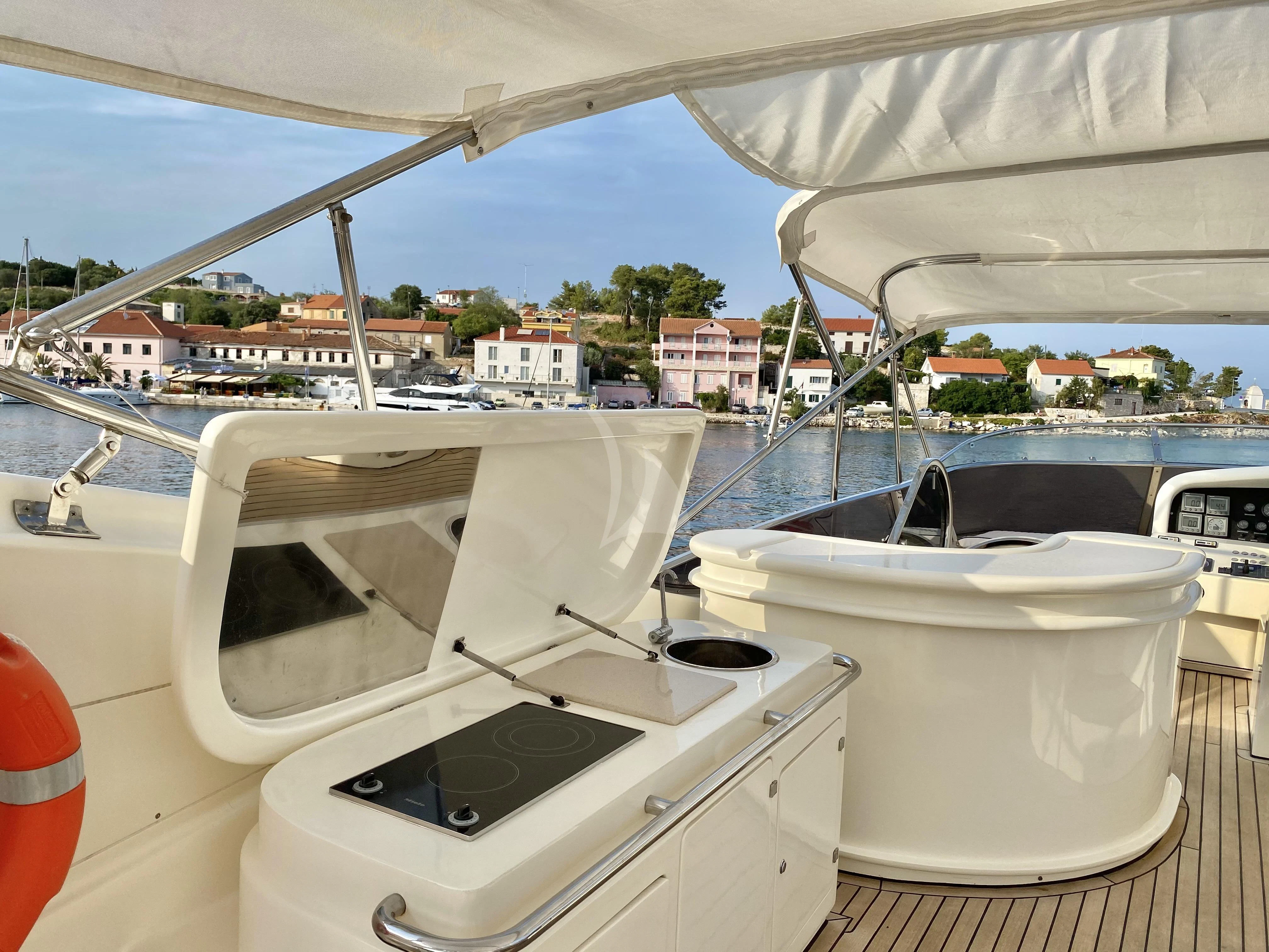 a boat with a seat aboard MAGIC SIX Yacht for Sale
