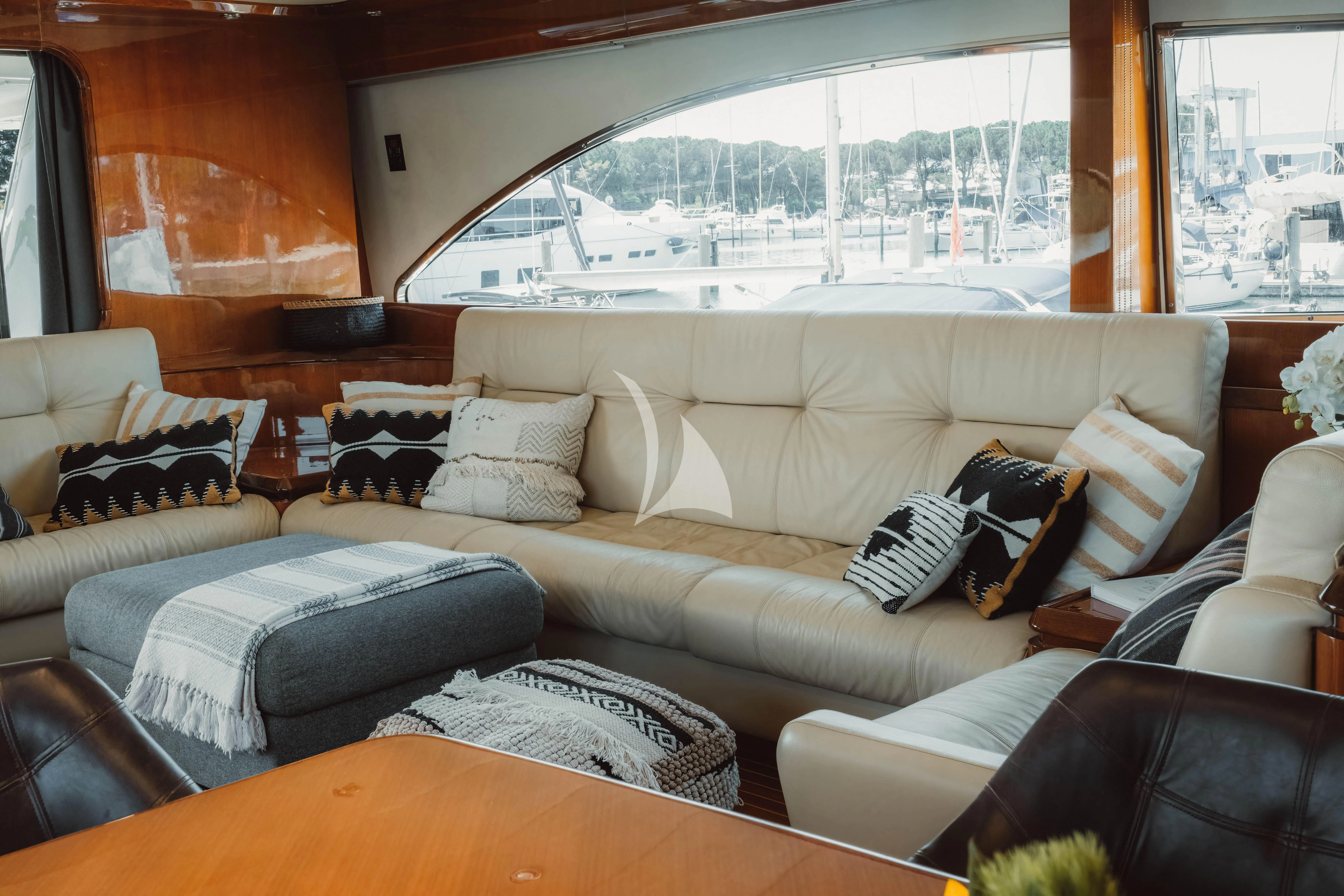 a living room with a large window aboard MAGIC SIX Yacht for Sale