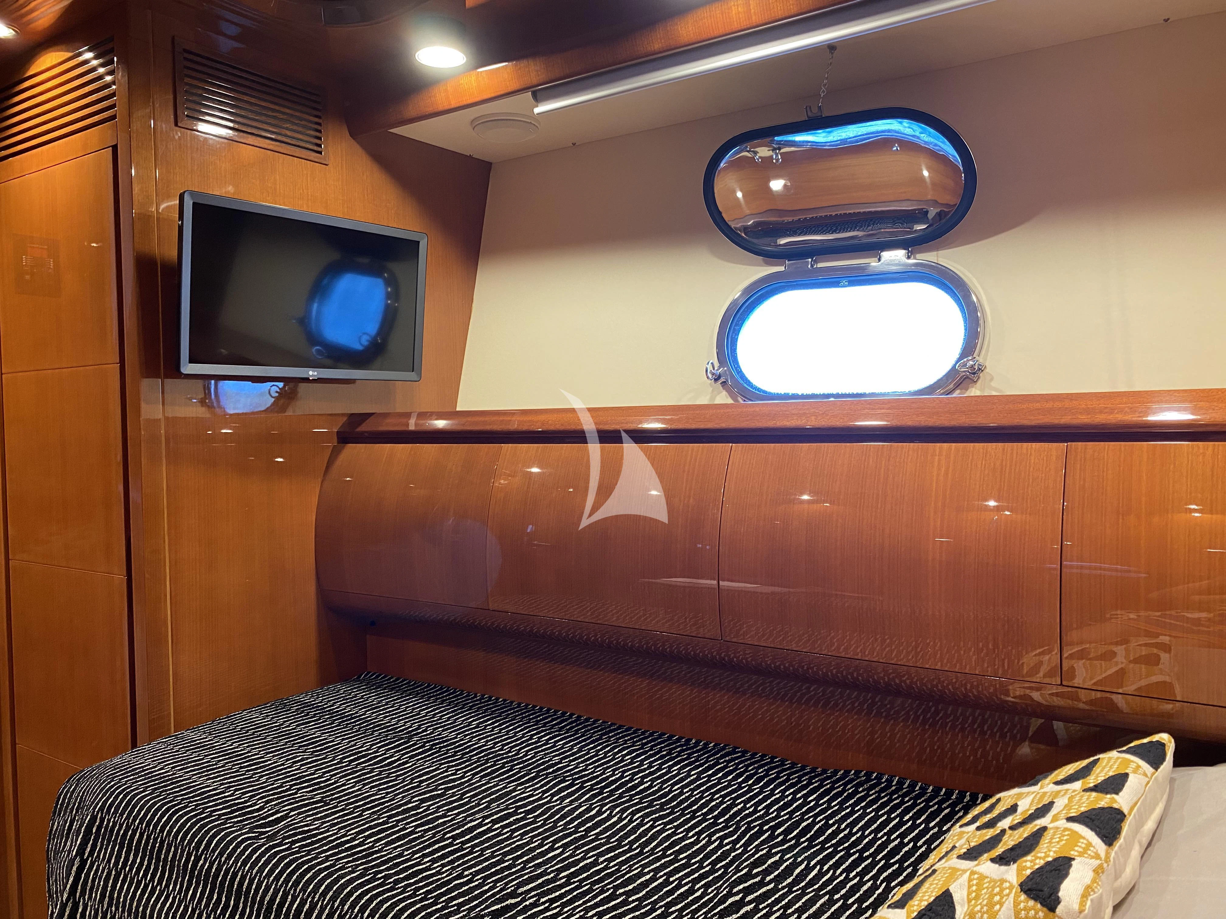 a tv on a cabinet aboard MAGIC SIX Yacht for Sale