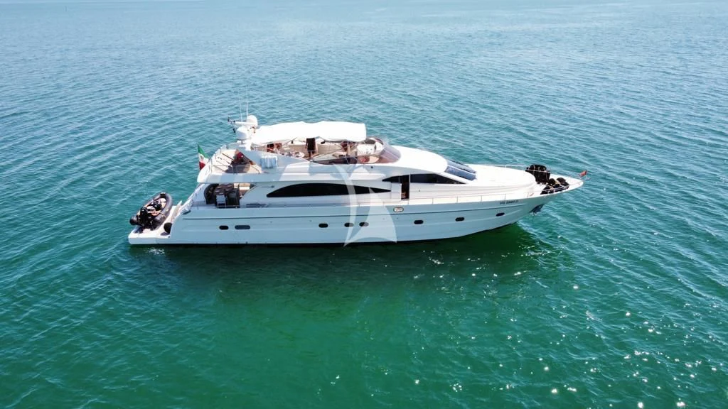 a white boat in the water aboard MAGIC SIX Yacht for Sale