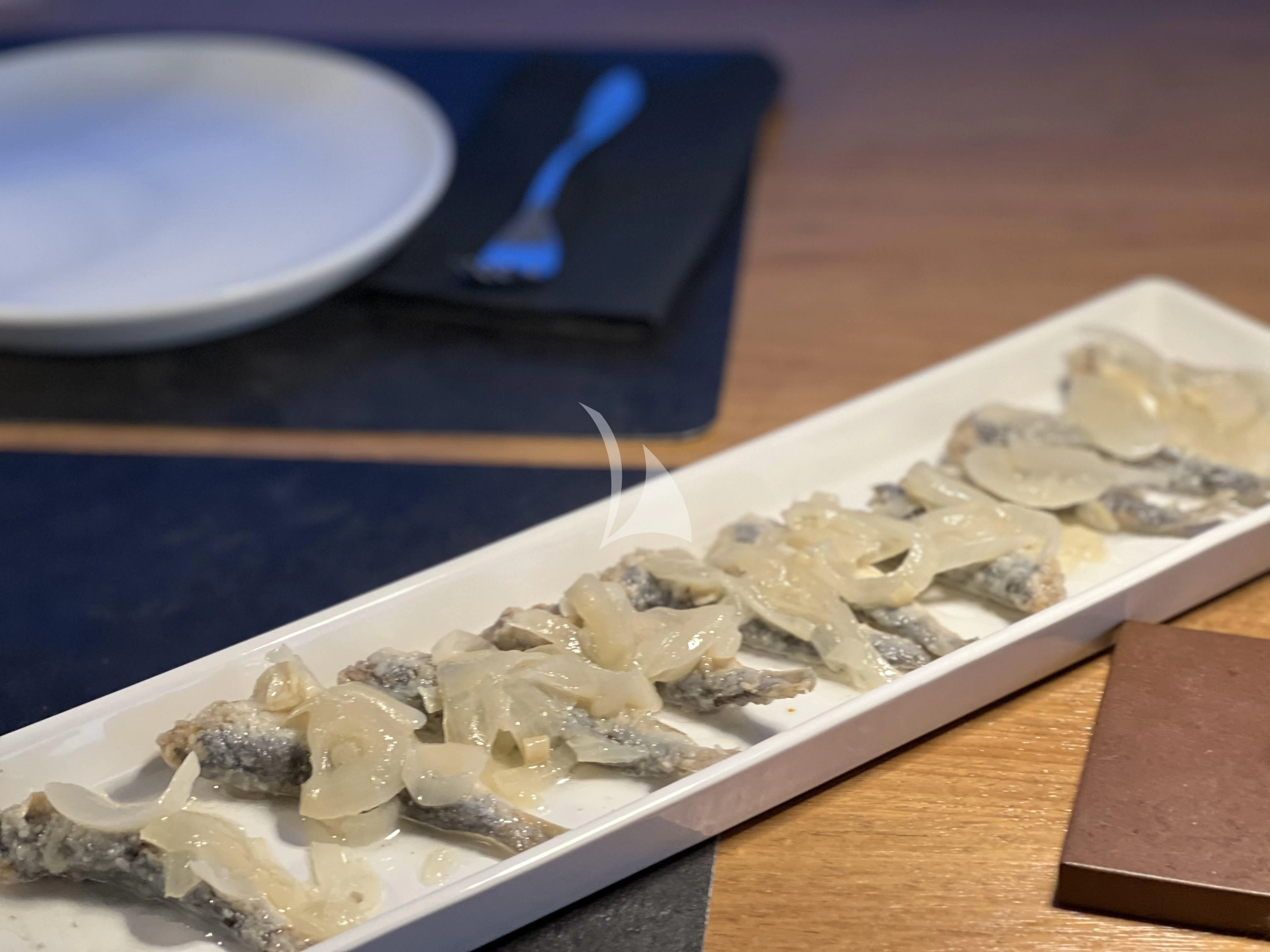 a plate of food aboard MAGIC SIX Yacht for Sale