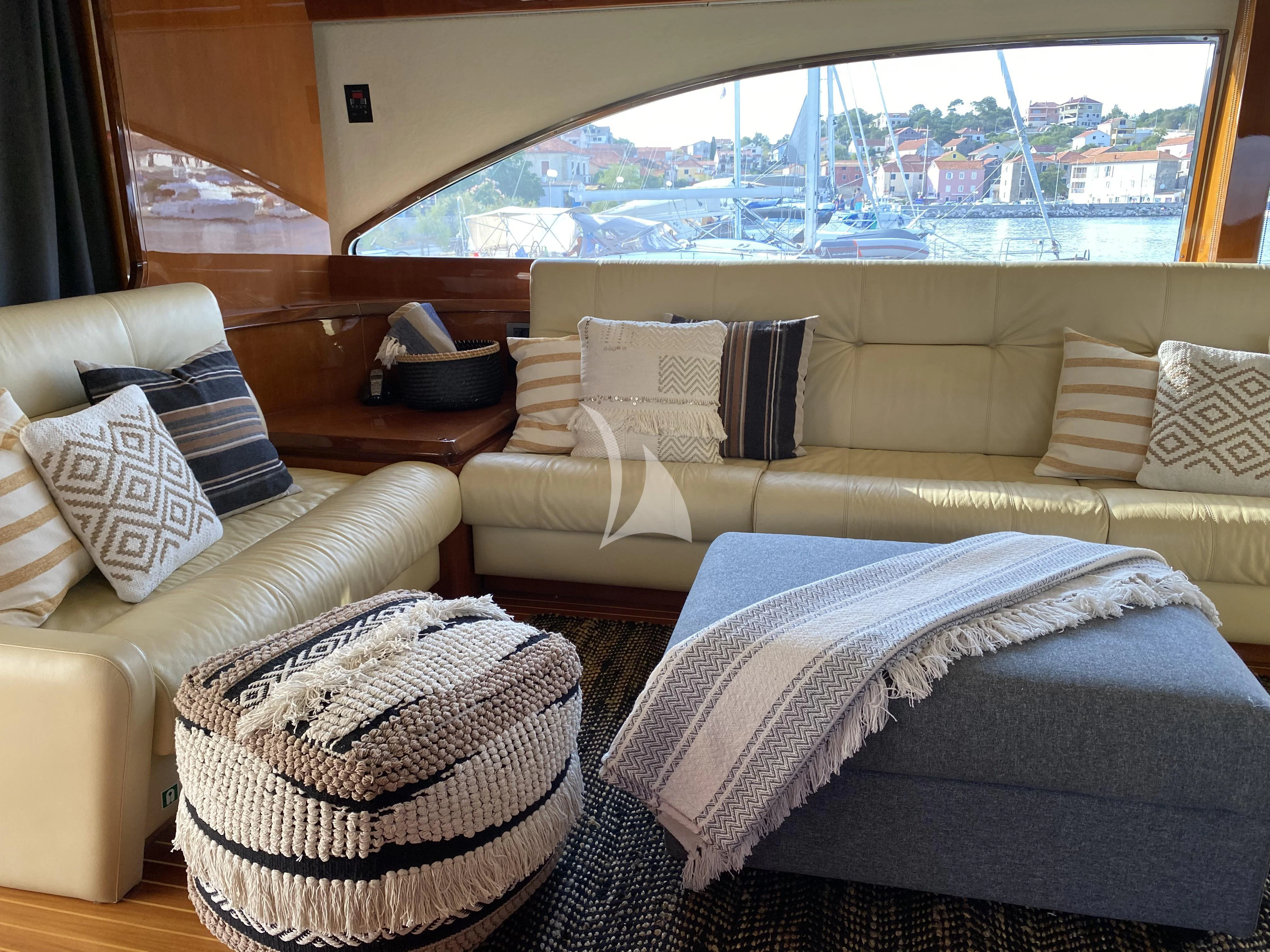 a room with a bed and a couch aboard MAGIC SIX Yacht for Sale