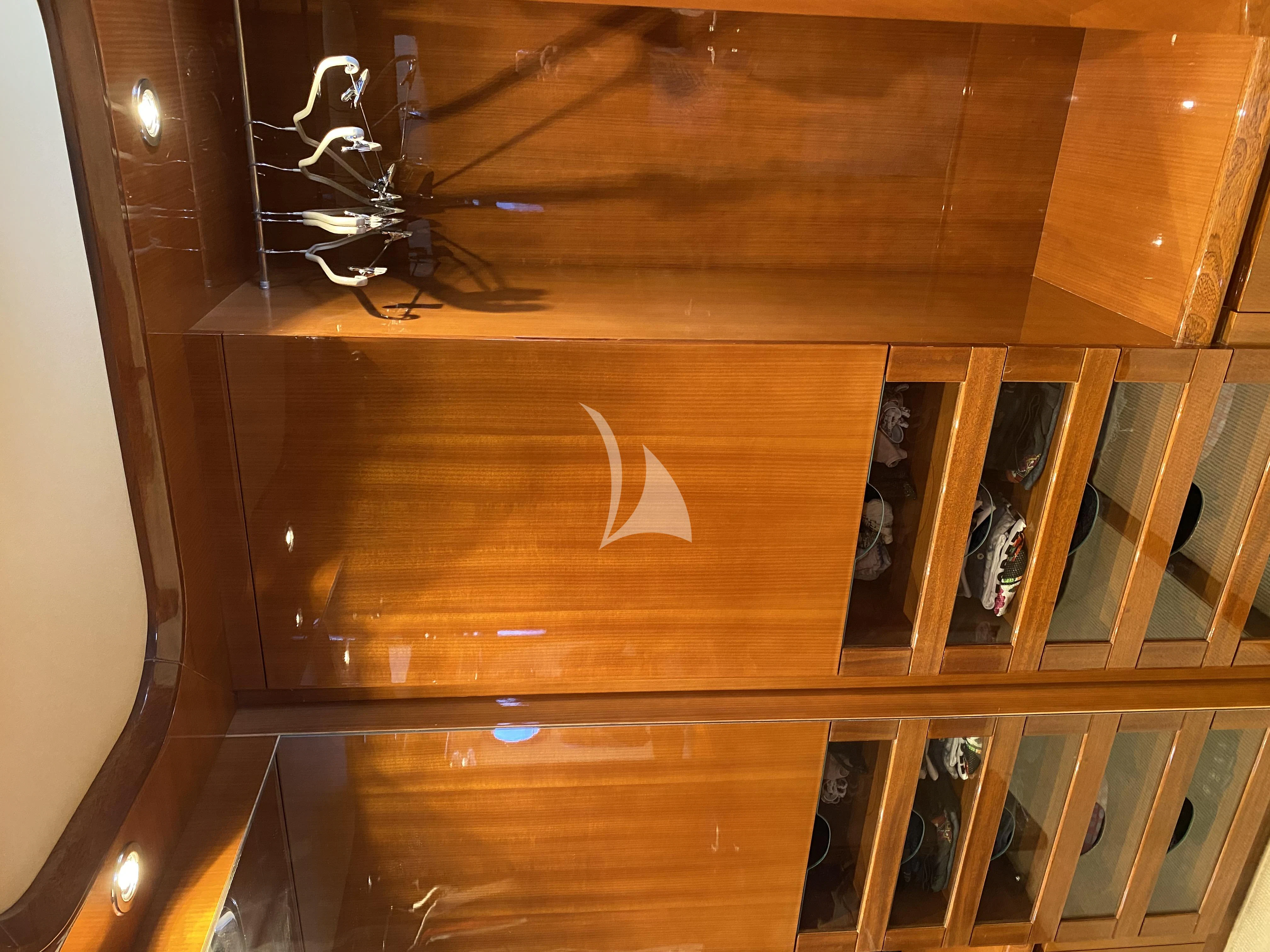 a wooden cabinet with a light aboard MAGIC SIX Yacht for Sale
