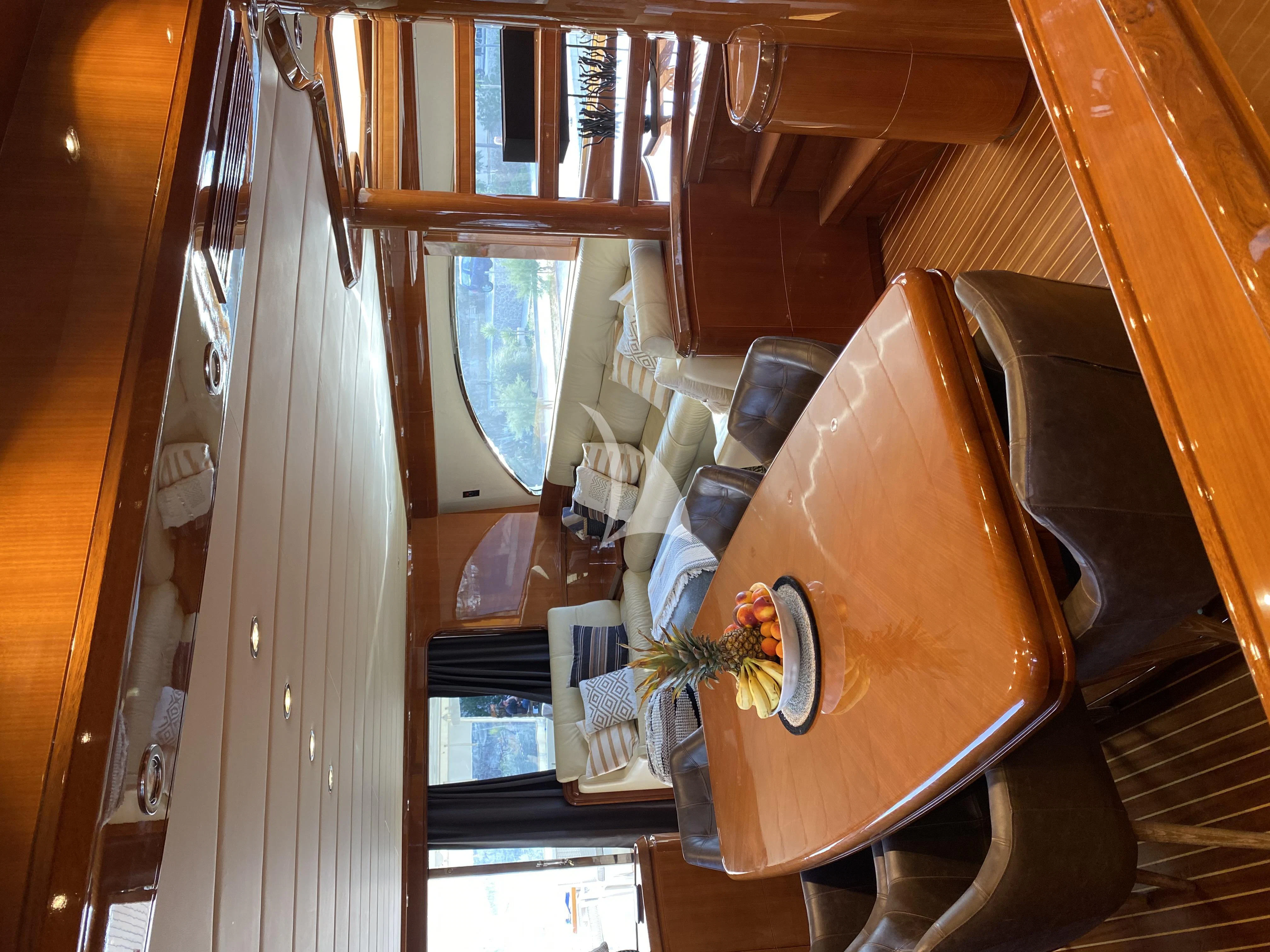 a brown leather chair in a room aboard MAGIC SIX Yacht for Sale