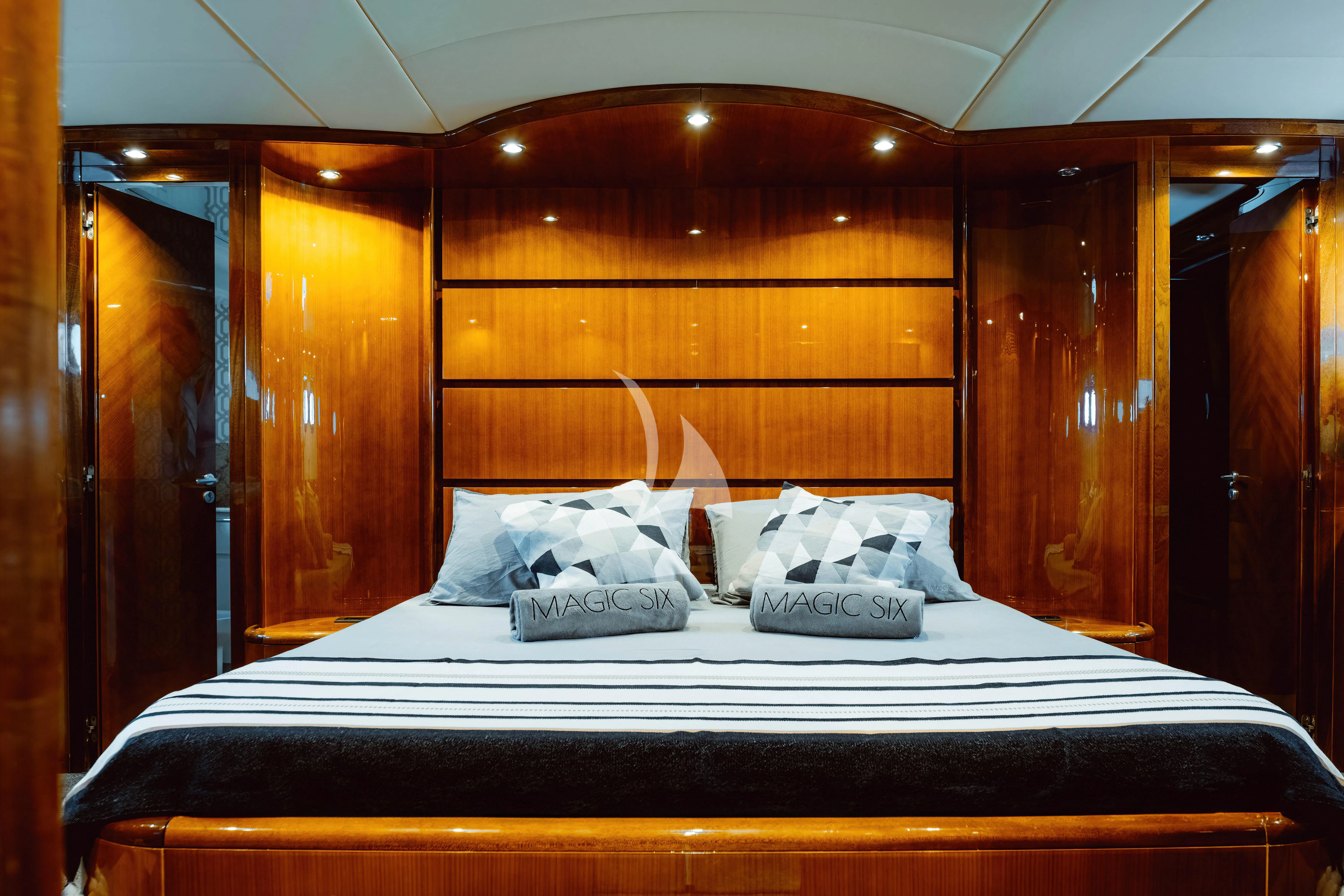a bed with white sheets aboard MAGIC SIX Yacht for Sale