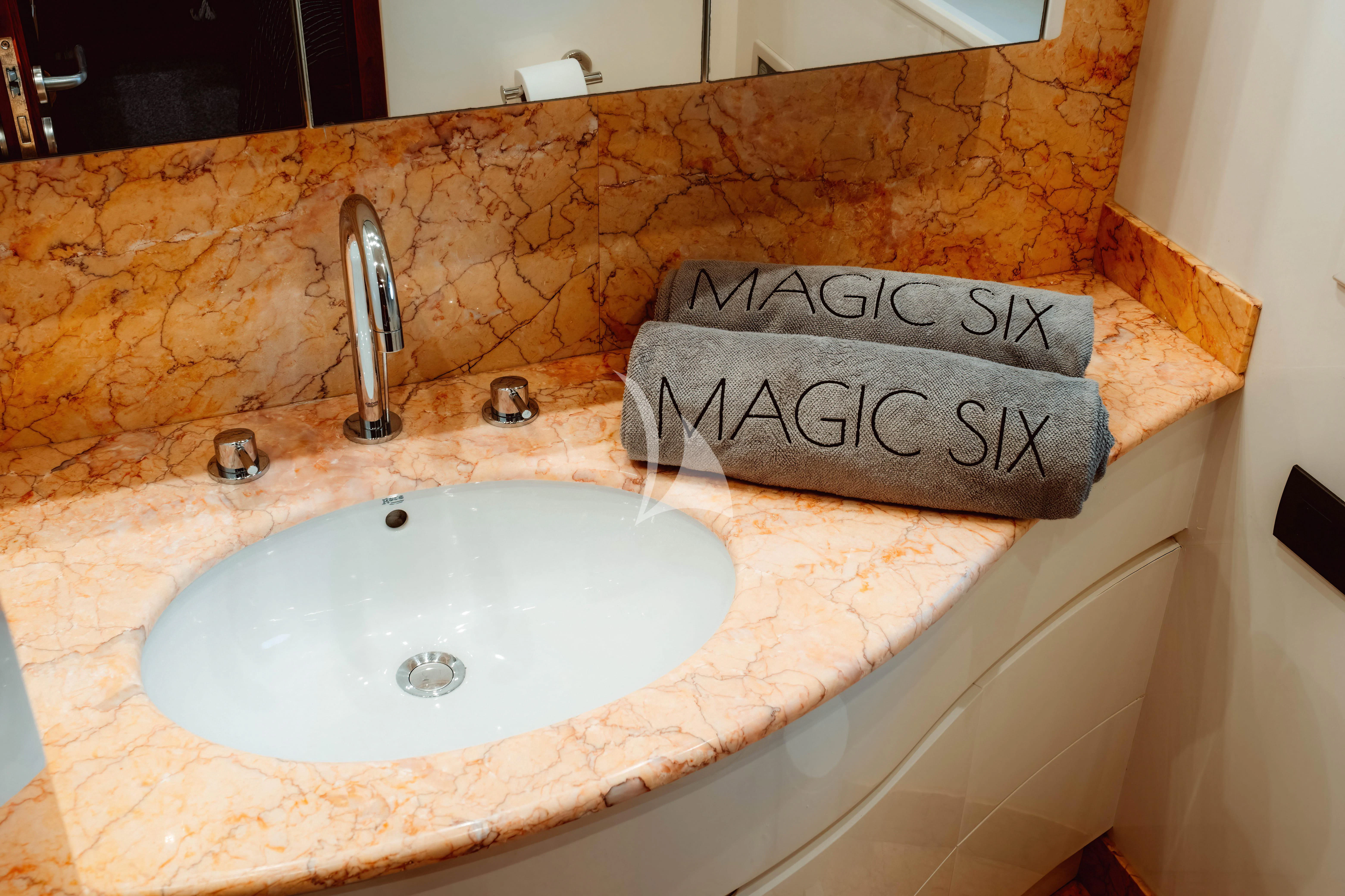 a bathroom with a sink and a towel on the counter aboard MAGIC SIX Yacht for Sale