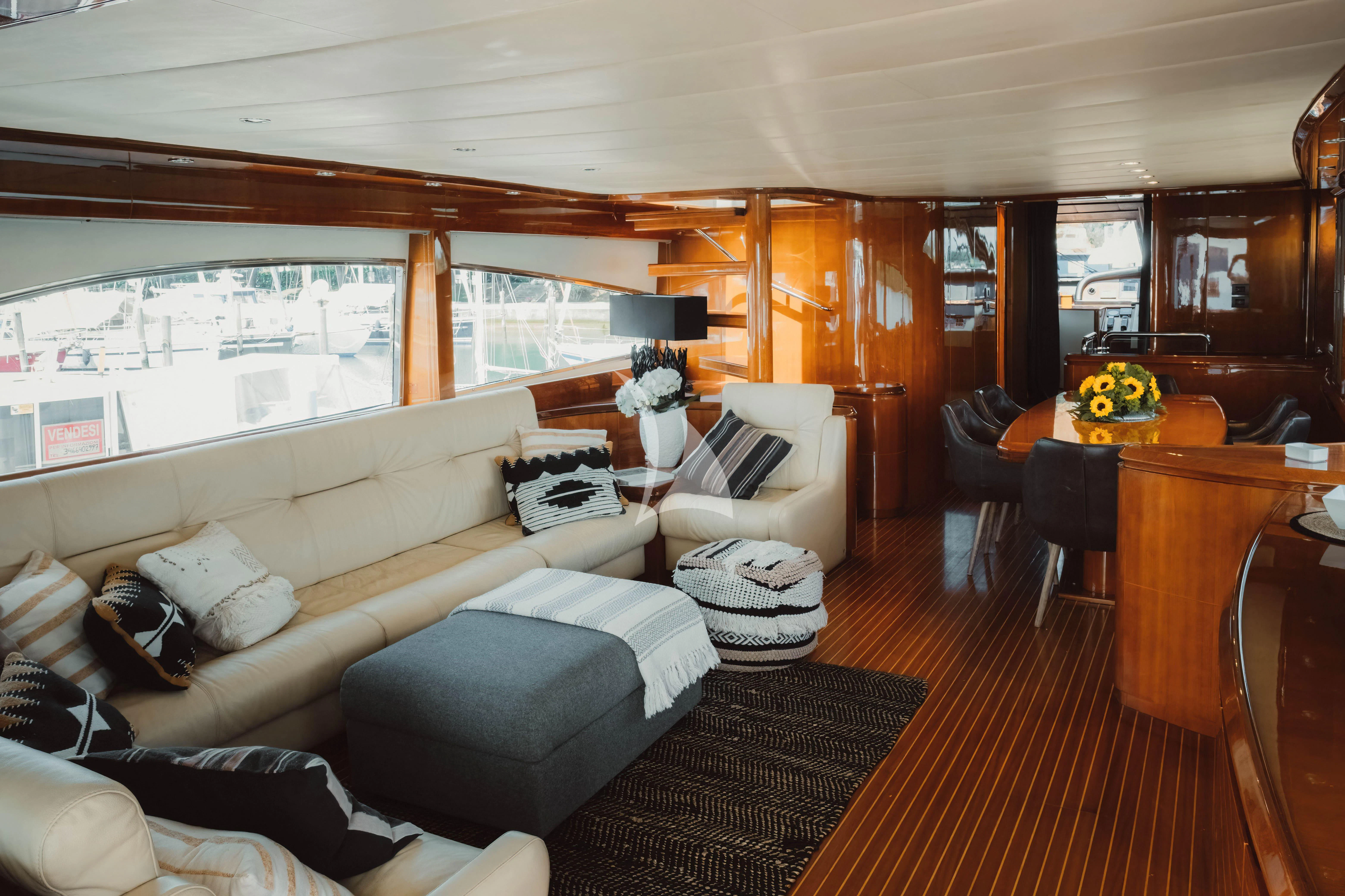 a living room with a large window aboard MAGIC SIX Yacht for Sale