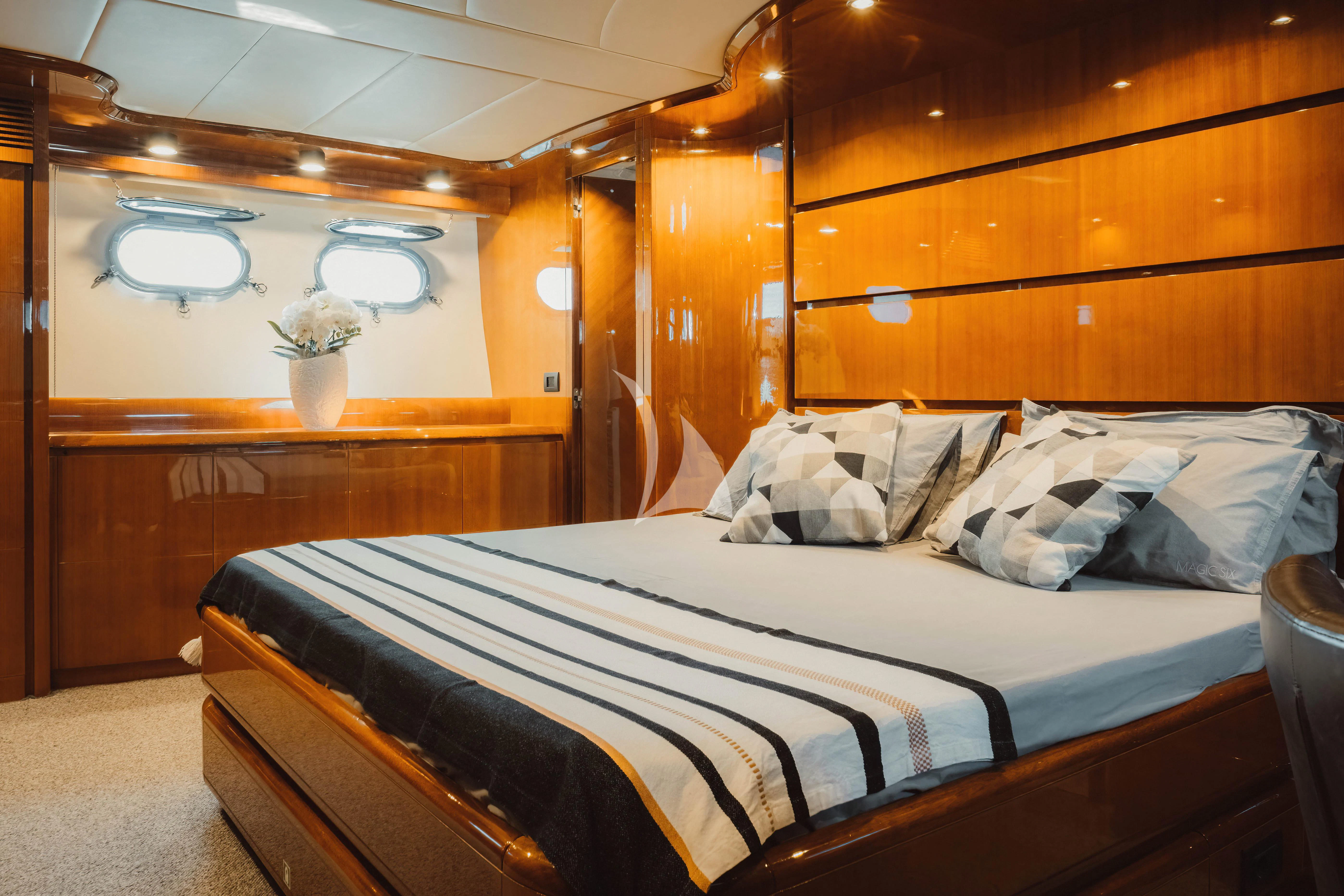 a bed with white sheets aboard MAGIC SIX Yacht for Sale
