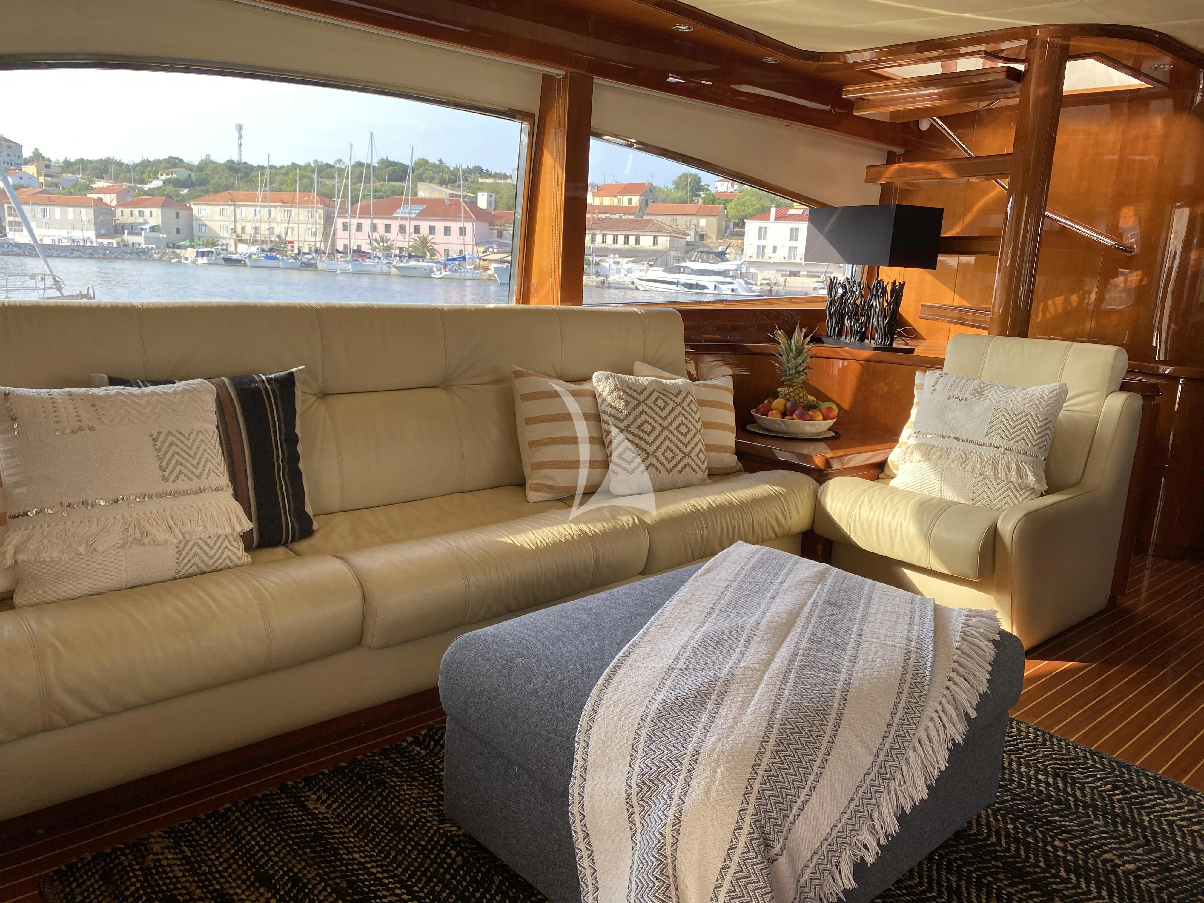 a living room with a large window aboard MAGIC SIX Yacht for Sale