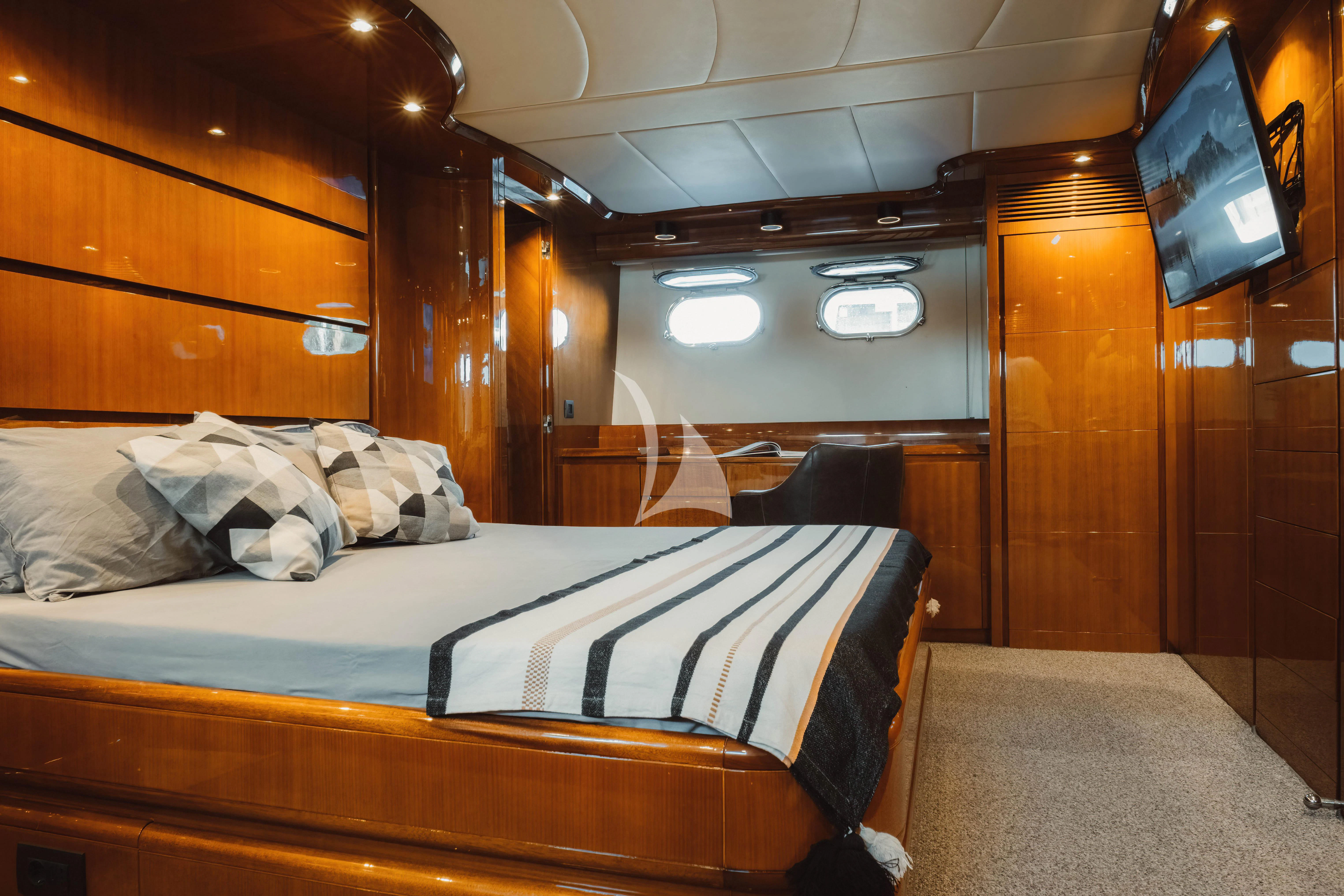 a room with a bed and a tv aboard MAGIC SIX Yacht for Sale
