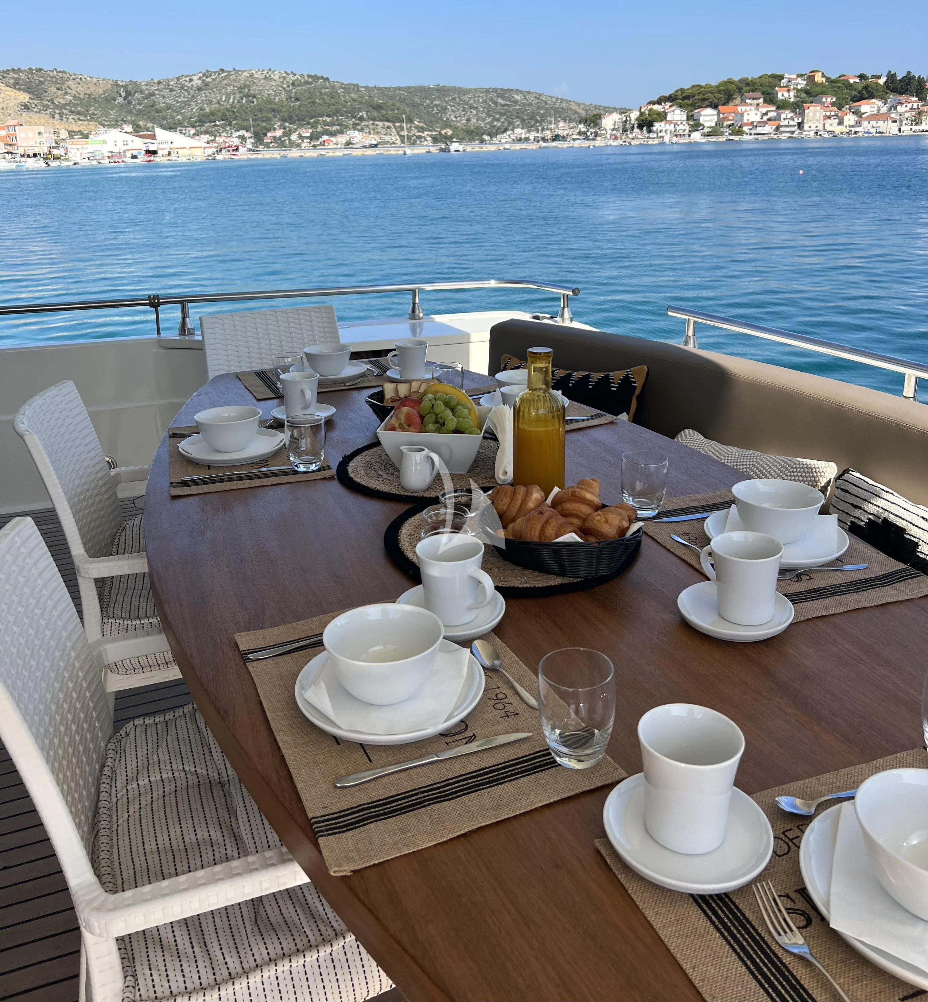 a table with food on it aboard MAGIC SIX Yacht for Sale