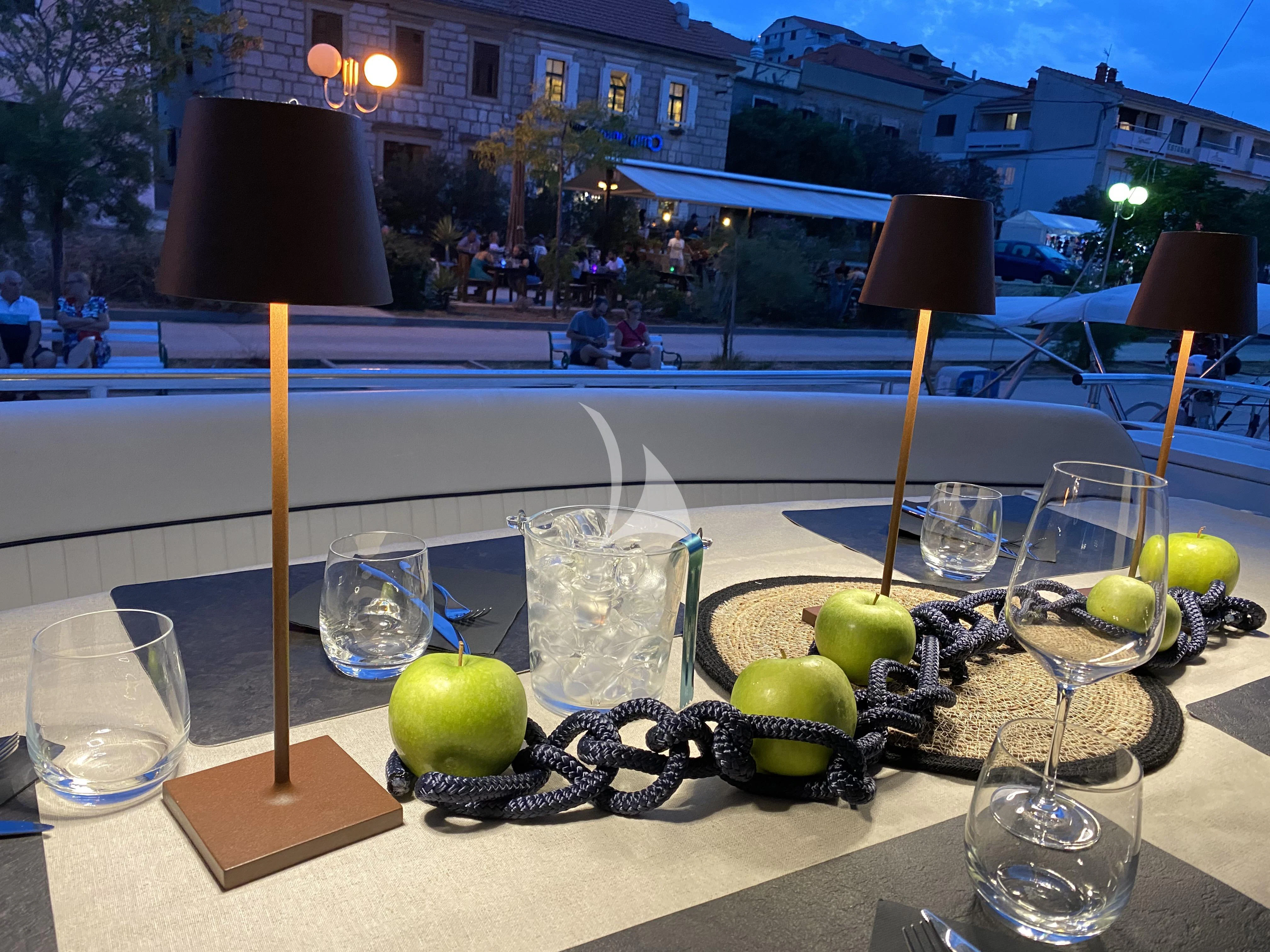 a table with fruit and glasses aboard MAGIC SIX Yacht for Sale