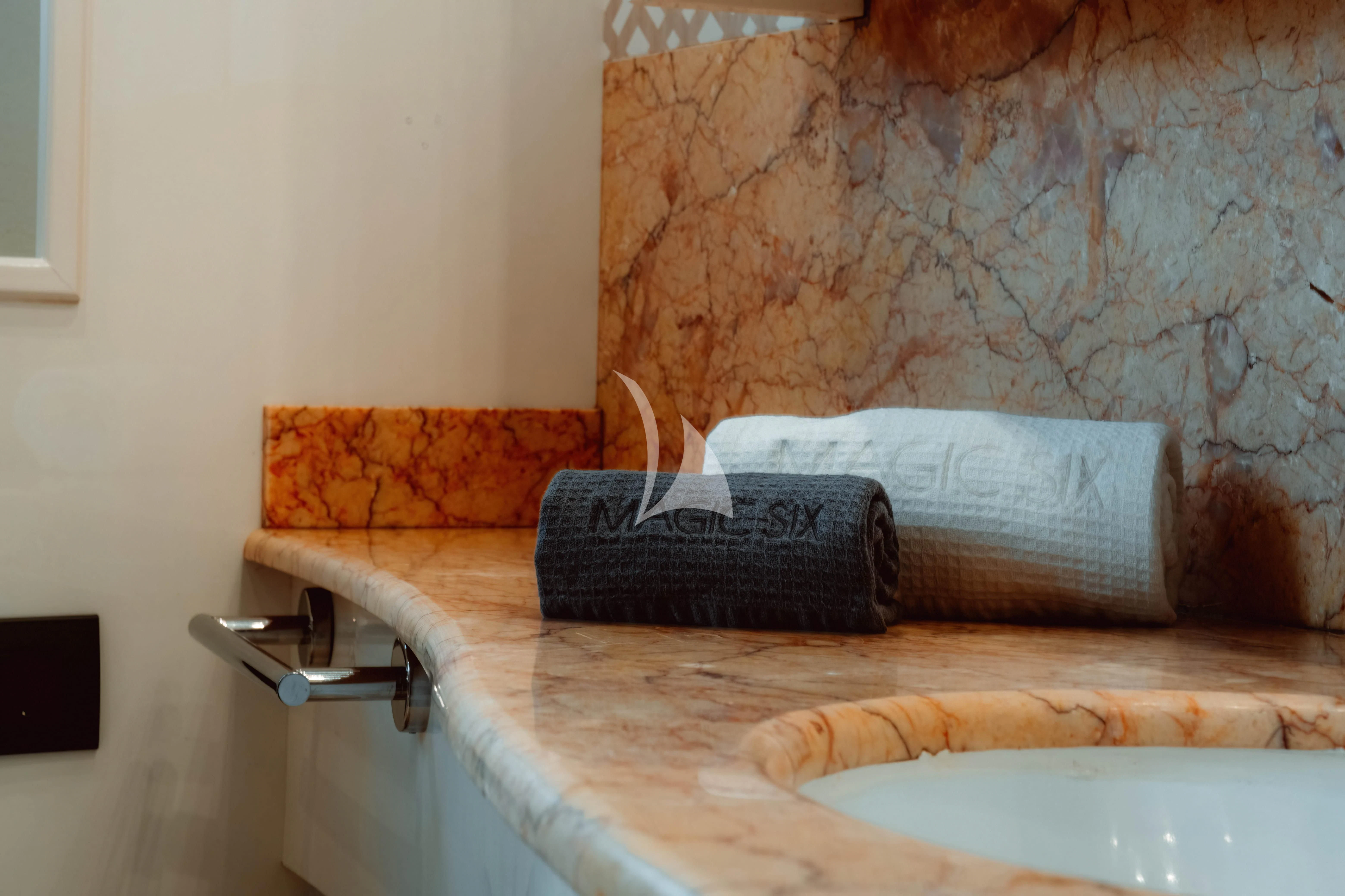 a black wallet on a counter aboard MAGIC SIX Yacht for Sale