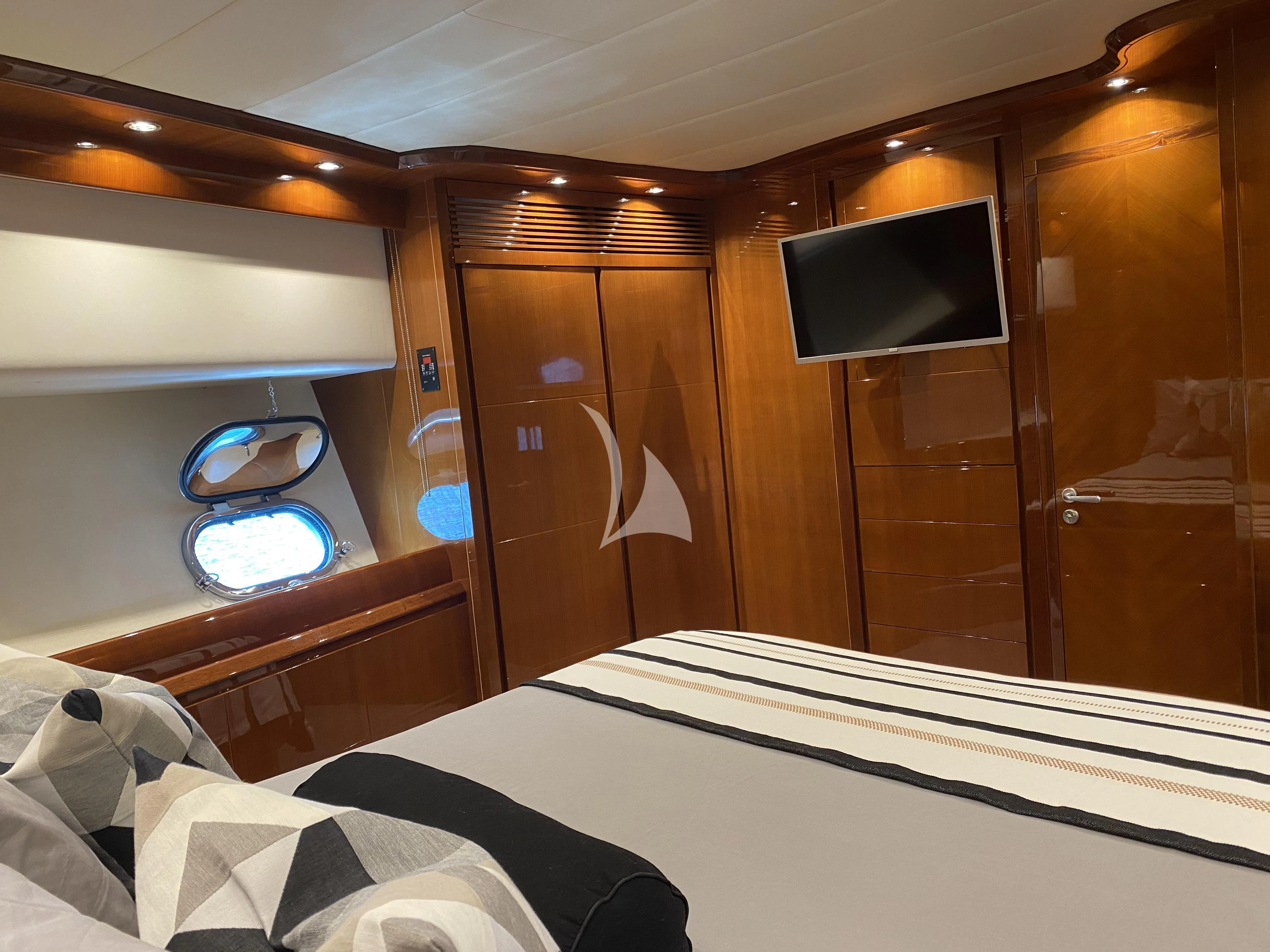 a bed with a tv on it aboard MAGIC SIX Yacht for Sale