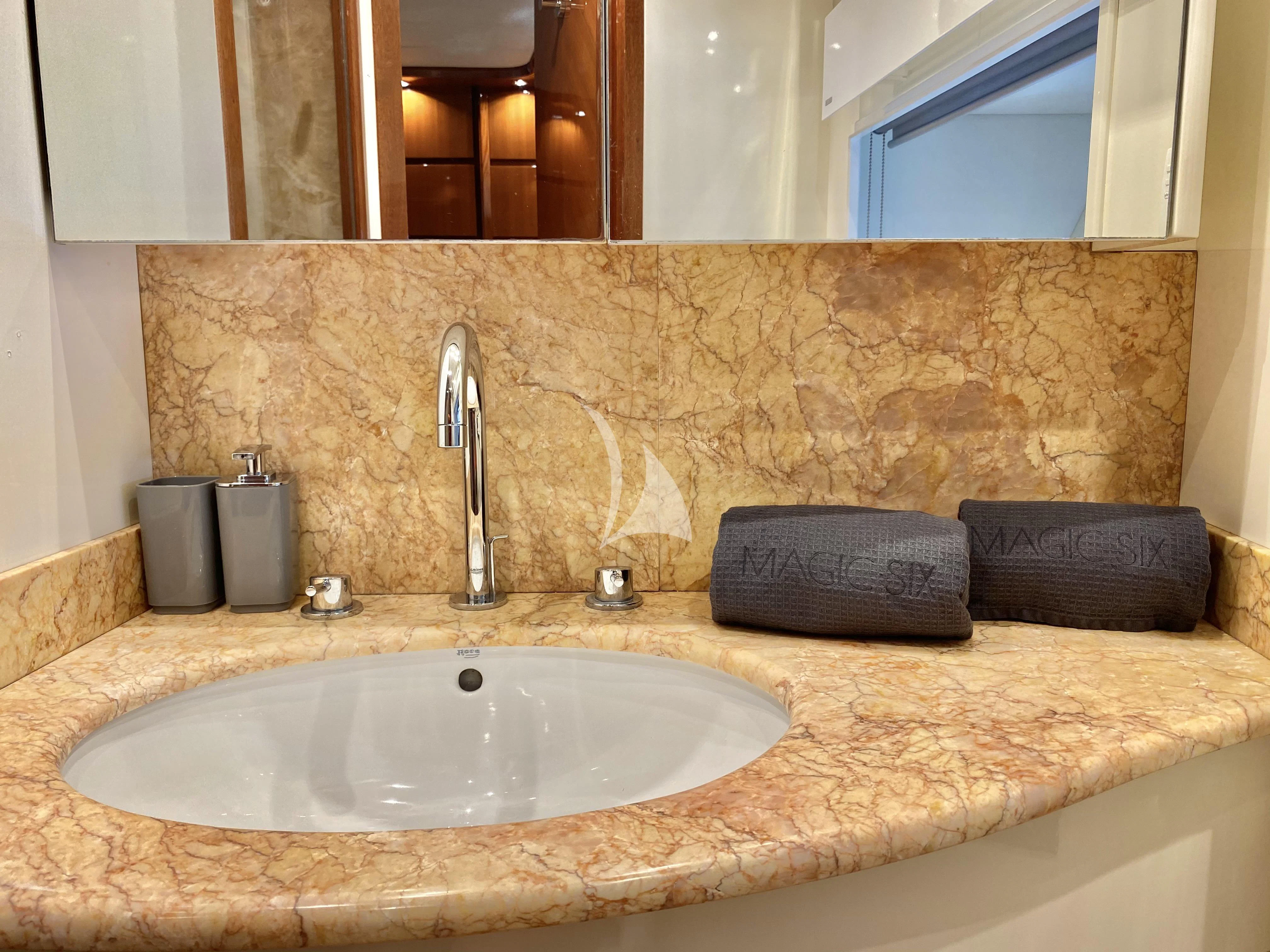 a bathroom with a sink and a towel rack aboard MAGIC SIX Yacht for Sale