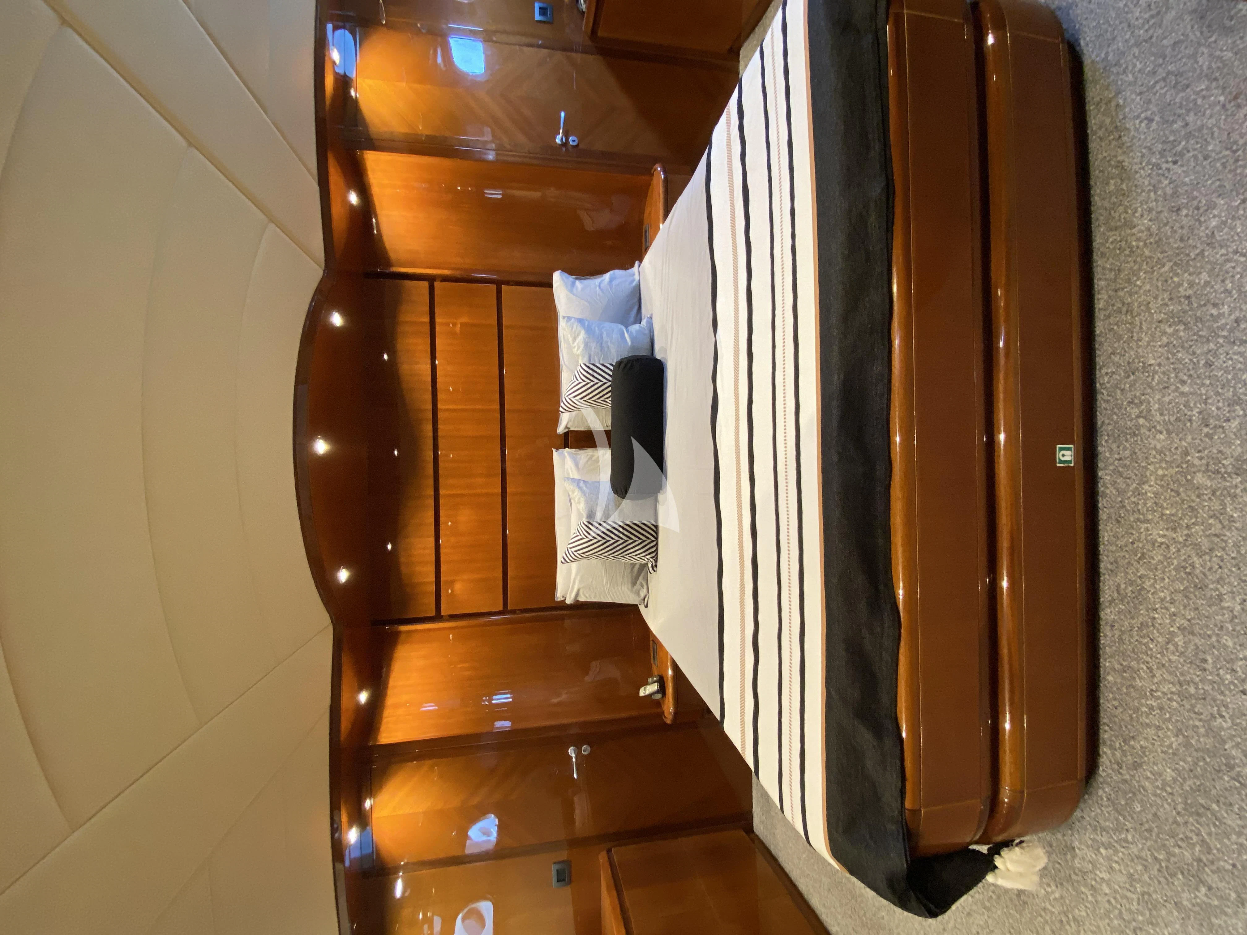 a closet with clothes on the wall aboard MAGIC SIX Yacht for Sale