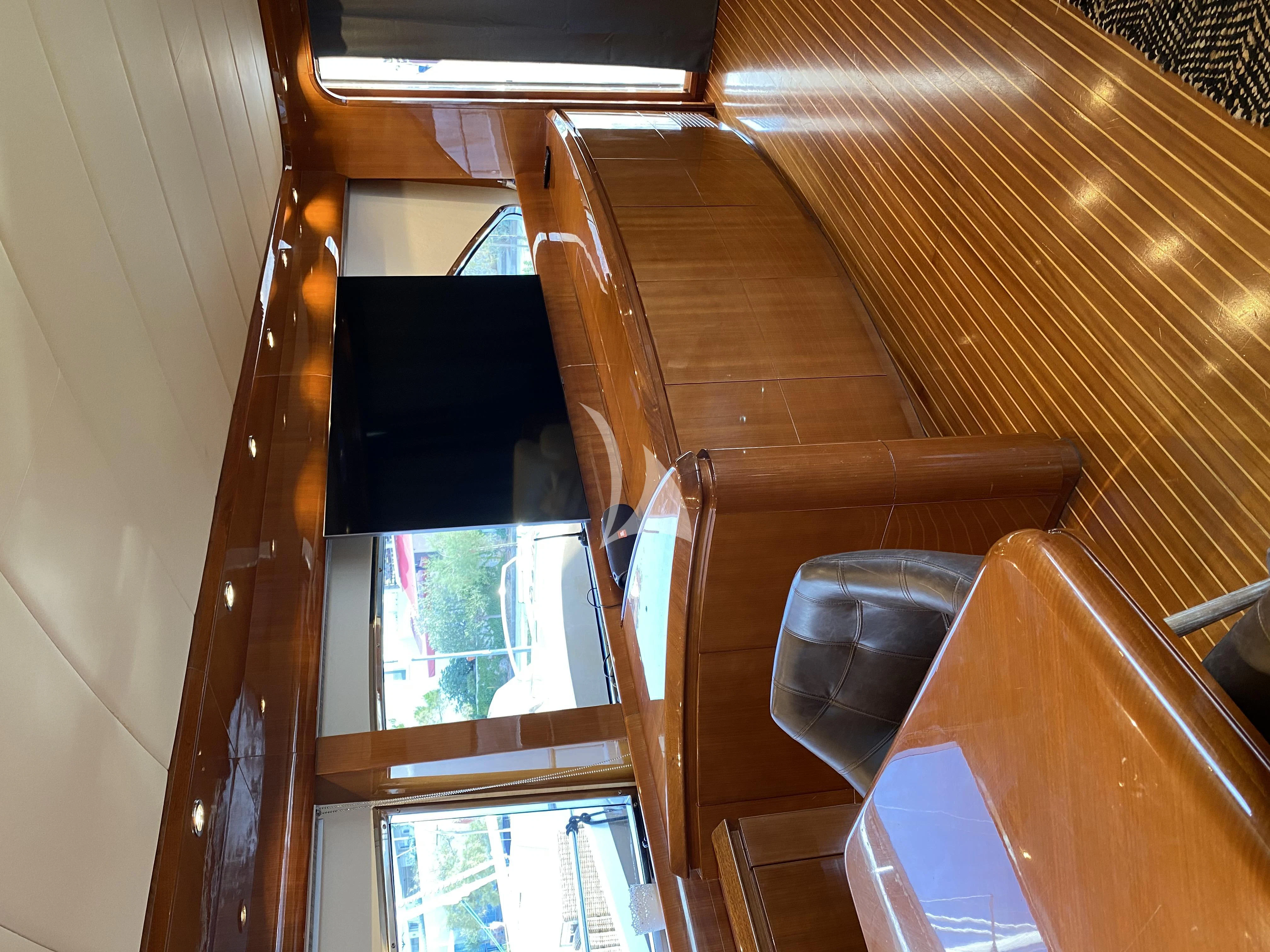 a wooden staircase with a window aboard MAGIC SIX Yacht for Sale