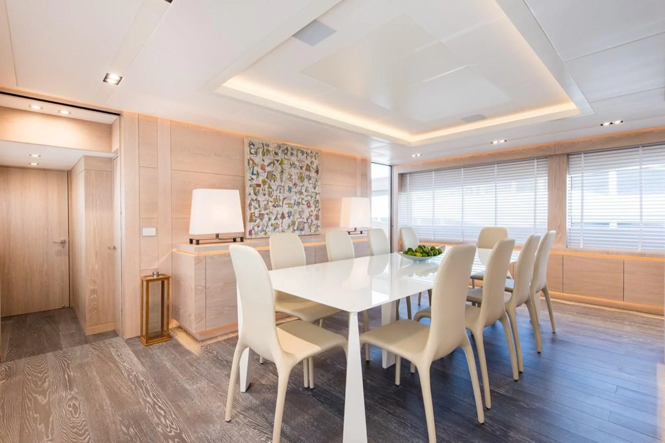 a room with a table and chairs aboard FAST & FURIOUS Yacht for Charter