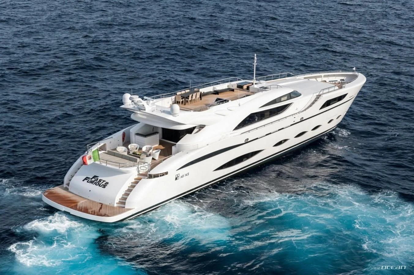 a white boat in the water aboard FAST & FURIOUS Yacht for Charter