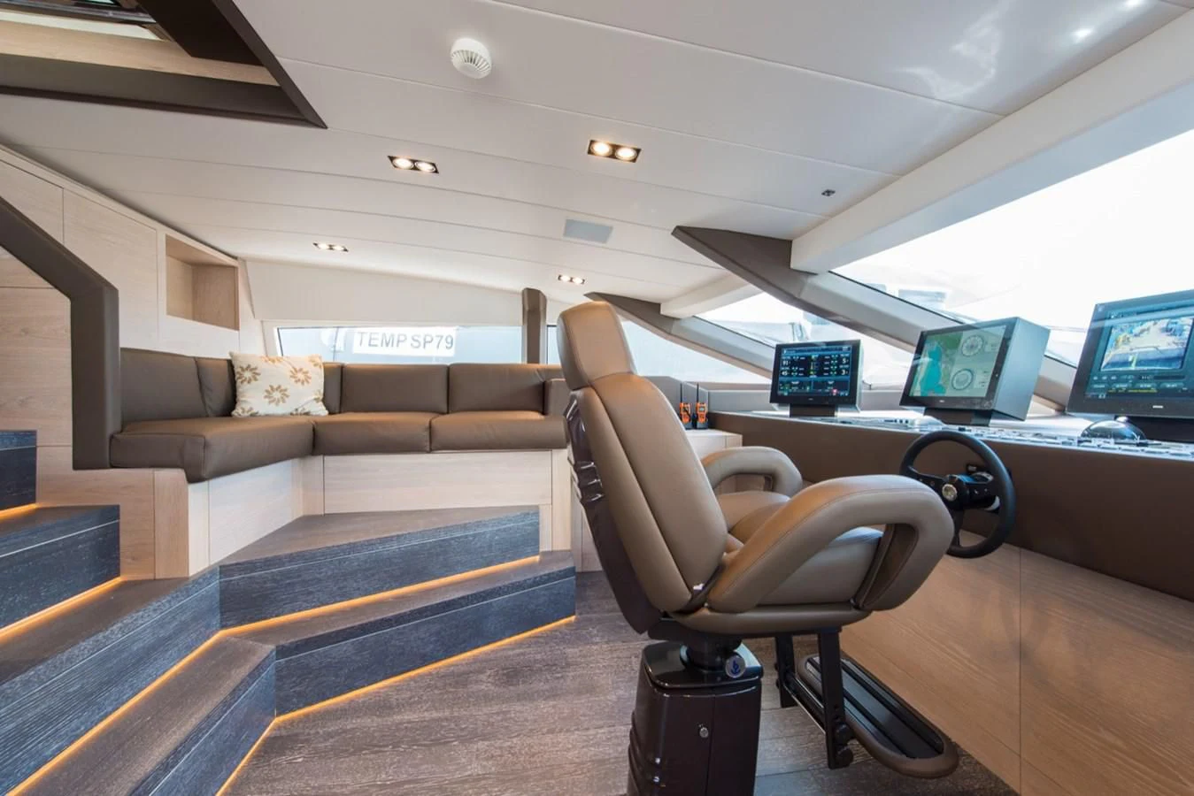 a leather chair in a room aboard FAST & FURIOUS Yacht for Charter