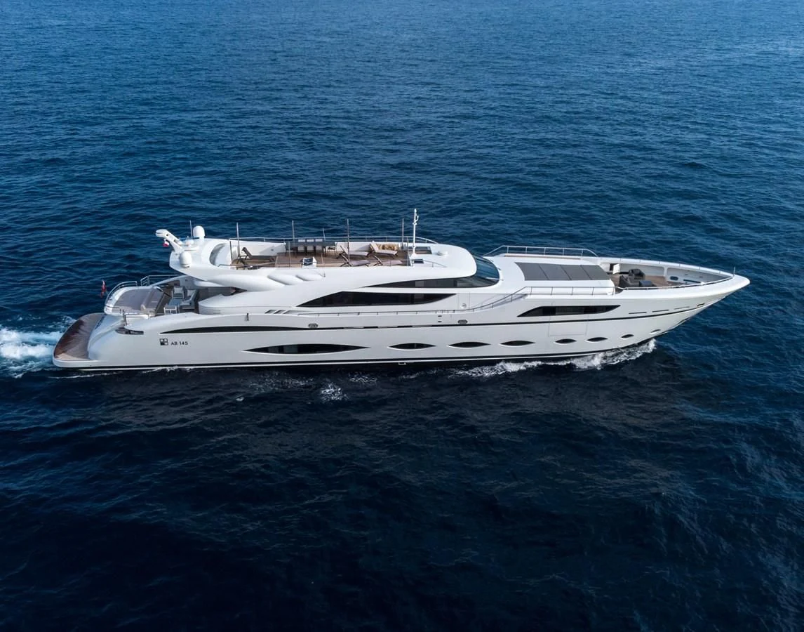 a white yacht in the ocean aboard FAST & FURIOUS Yacht for Charter
