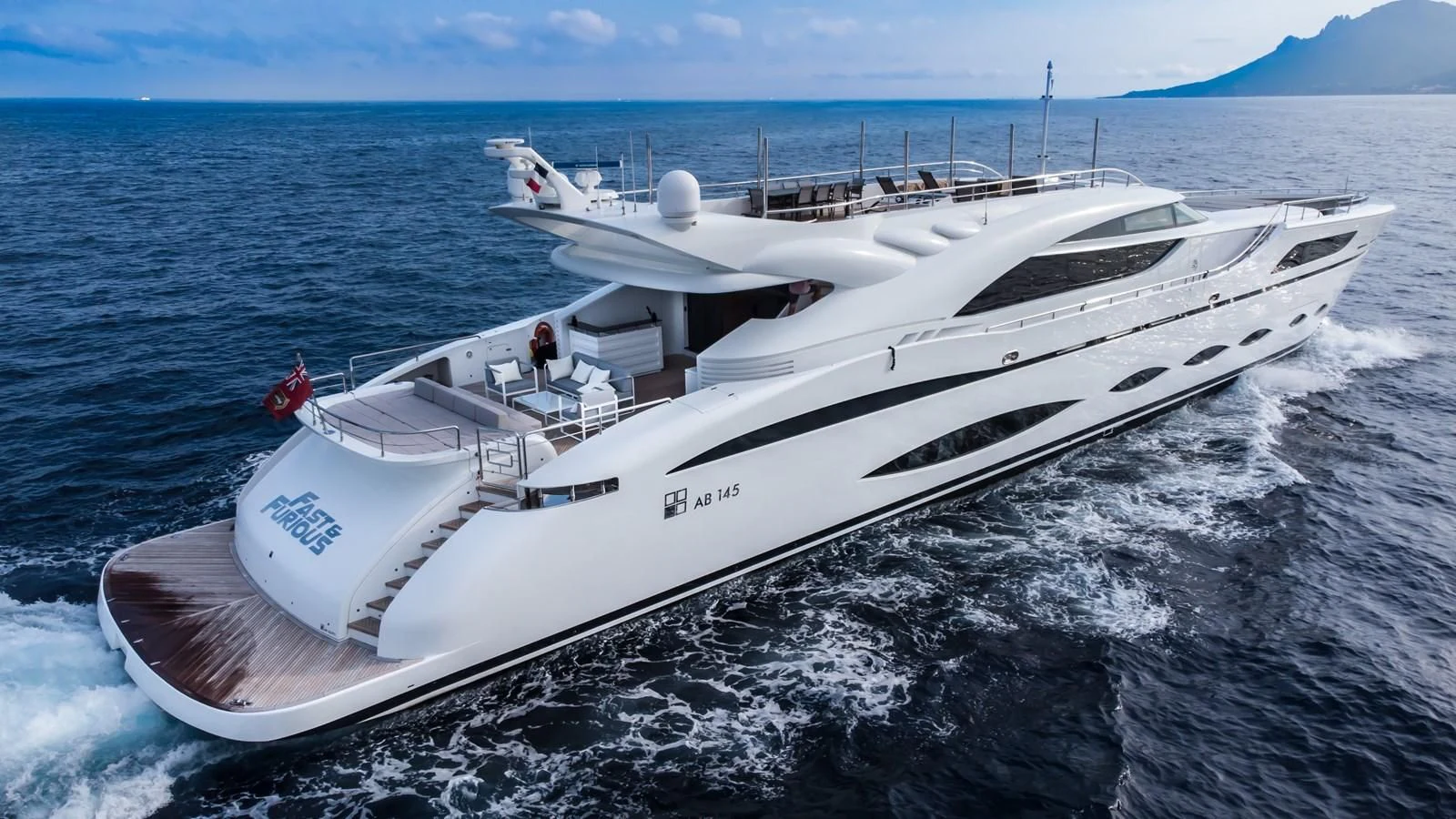 a white yacht on the water aboard FAST & FURIOUS Yacht for Charter