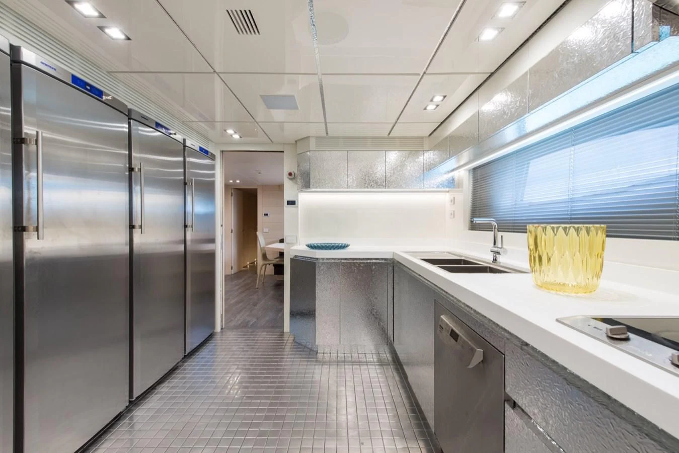 a large kitchen with stainless steel appliances aboard FAST & FURIOUS Yacht for Charter