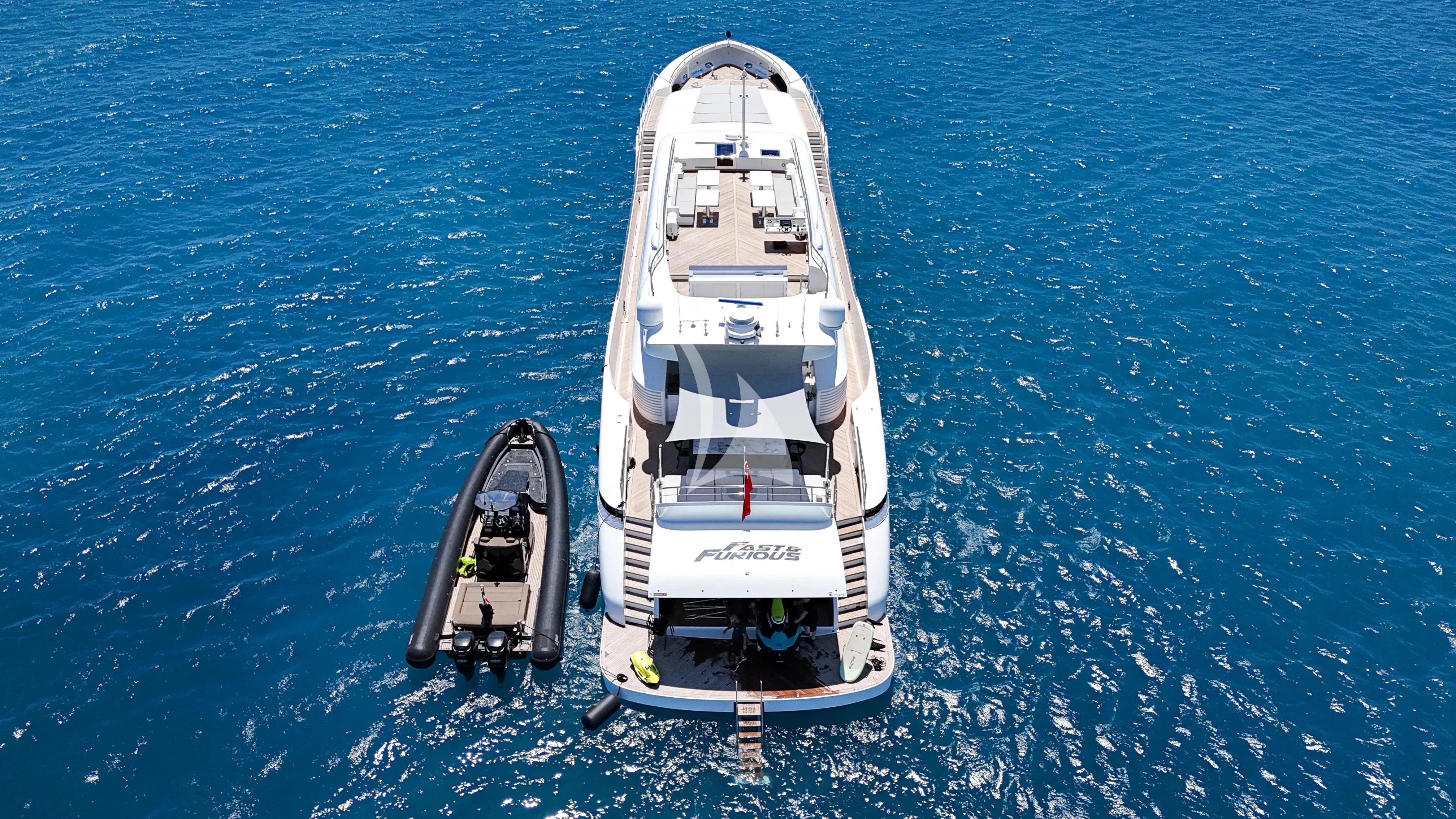 a couple of boats in the water aboard FAST & FURIOUS Yacht for Charter
