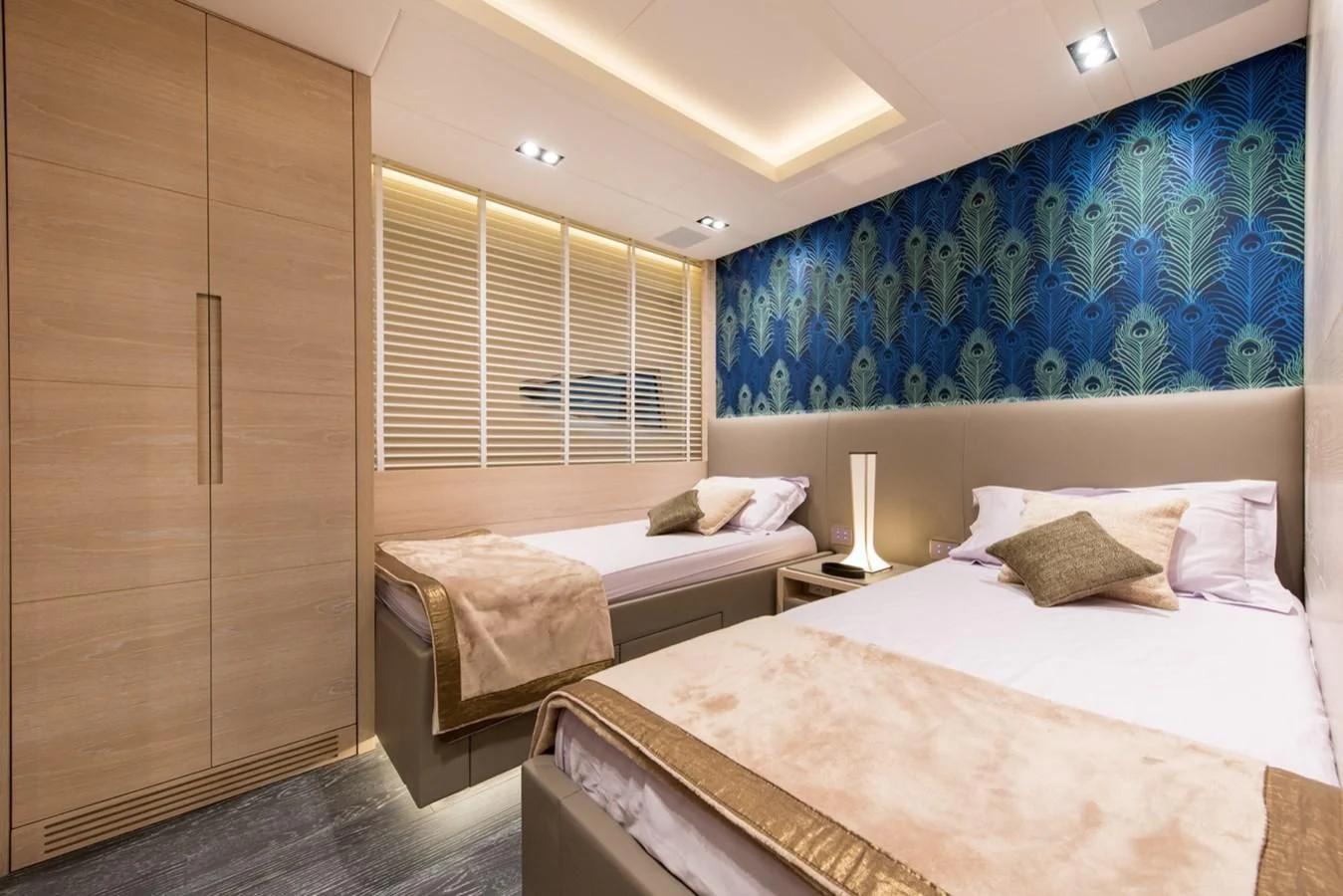 a couple of beds in a hotel room aboard FAST & FURIOUS Yacht for Charter