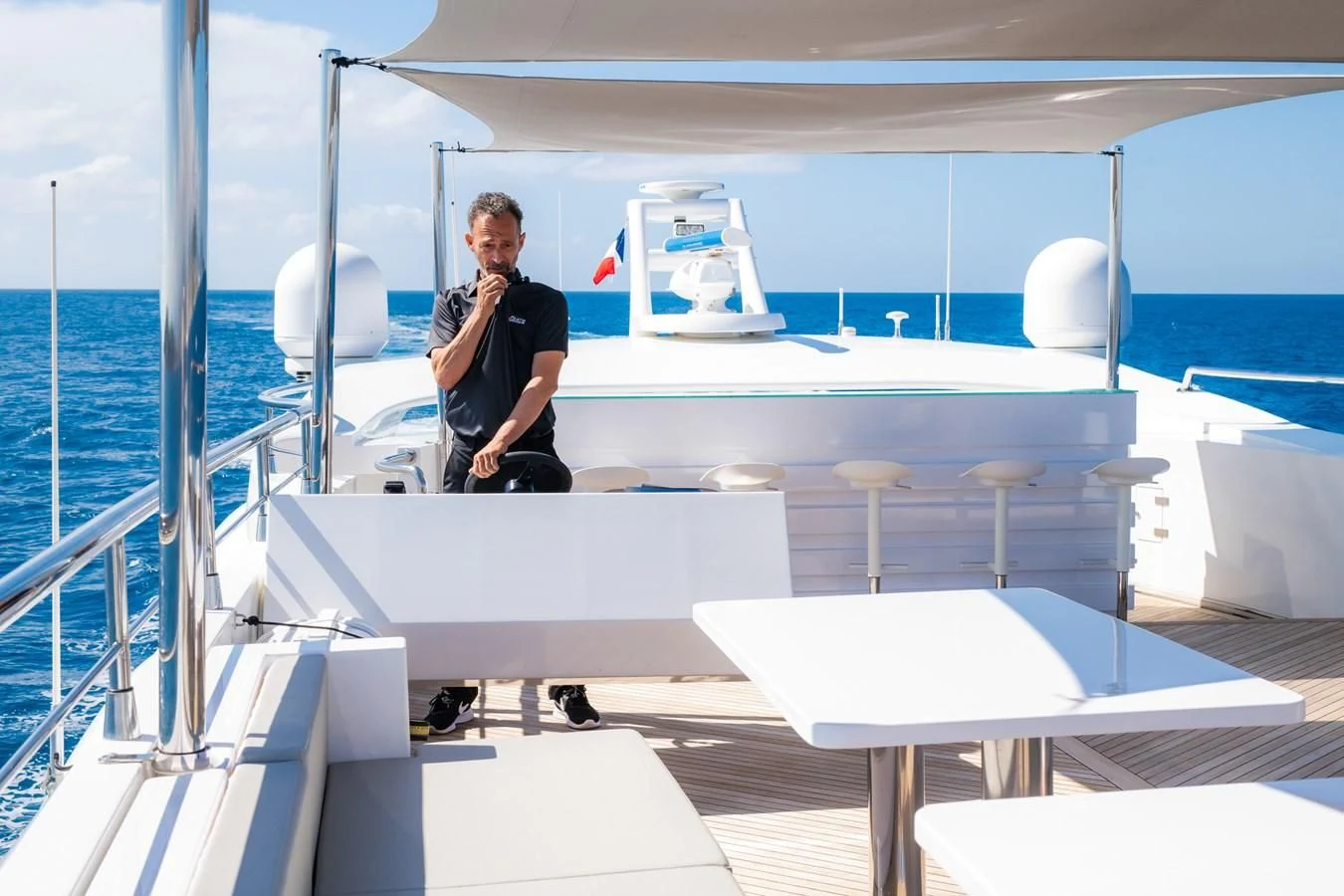 a person standing on a boat aboard FAST & FURIOUS Yacht for Charter