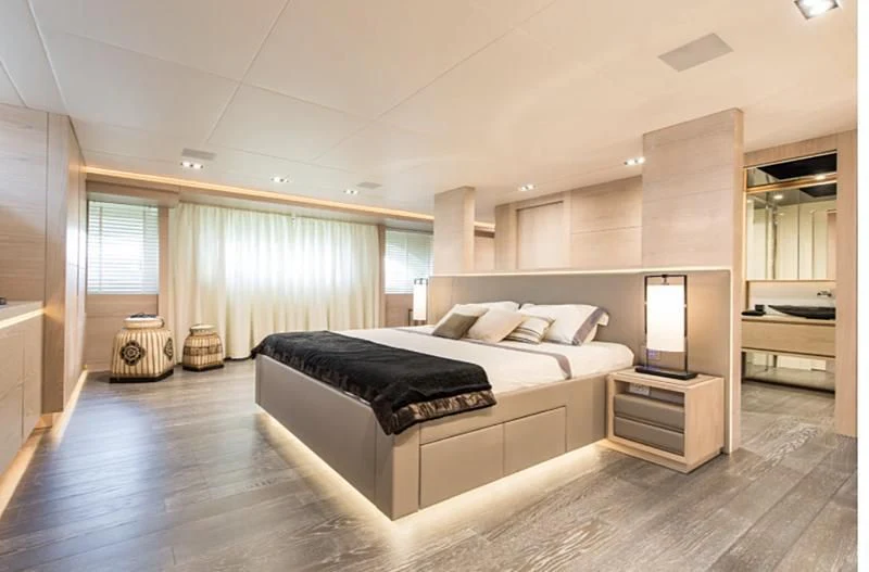 a large bedroom with a large bed aboard FAST & FURIOUS Yacht for Charter